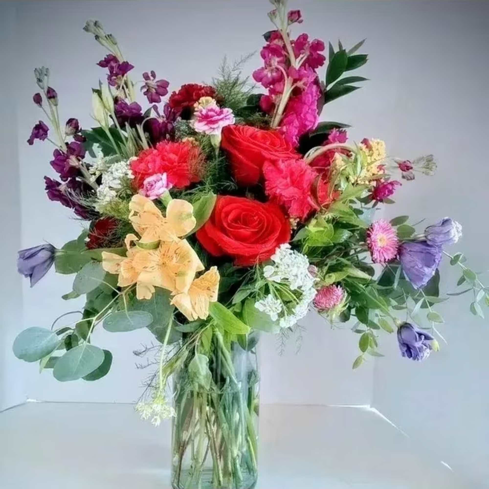 This combination of jewel tones and sweet flowers would be most welcome