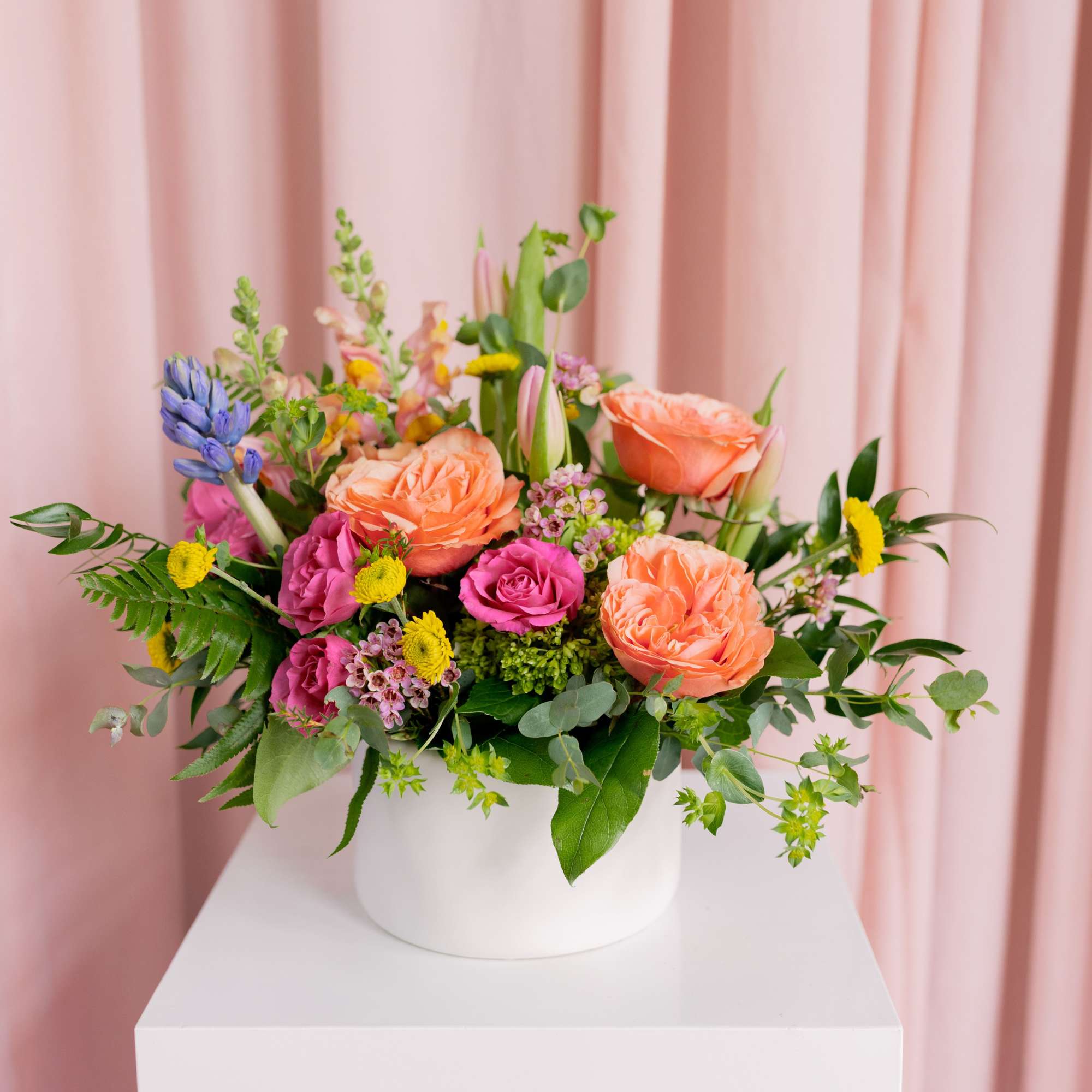 Fast-forward to spring! This seasonal arrangement is full, fresh, and designed to