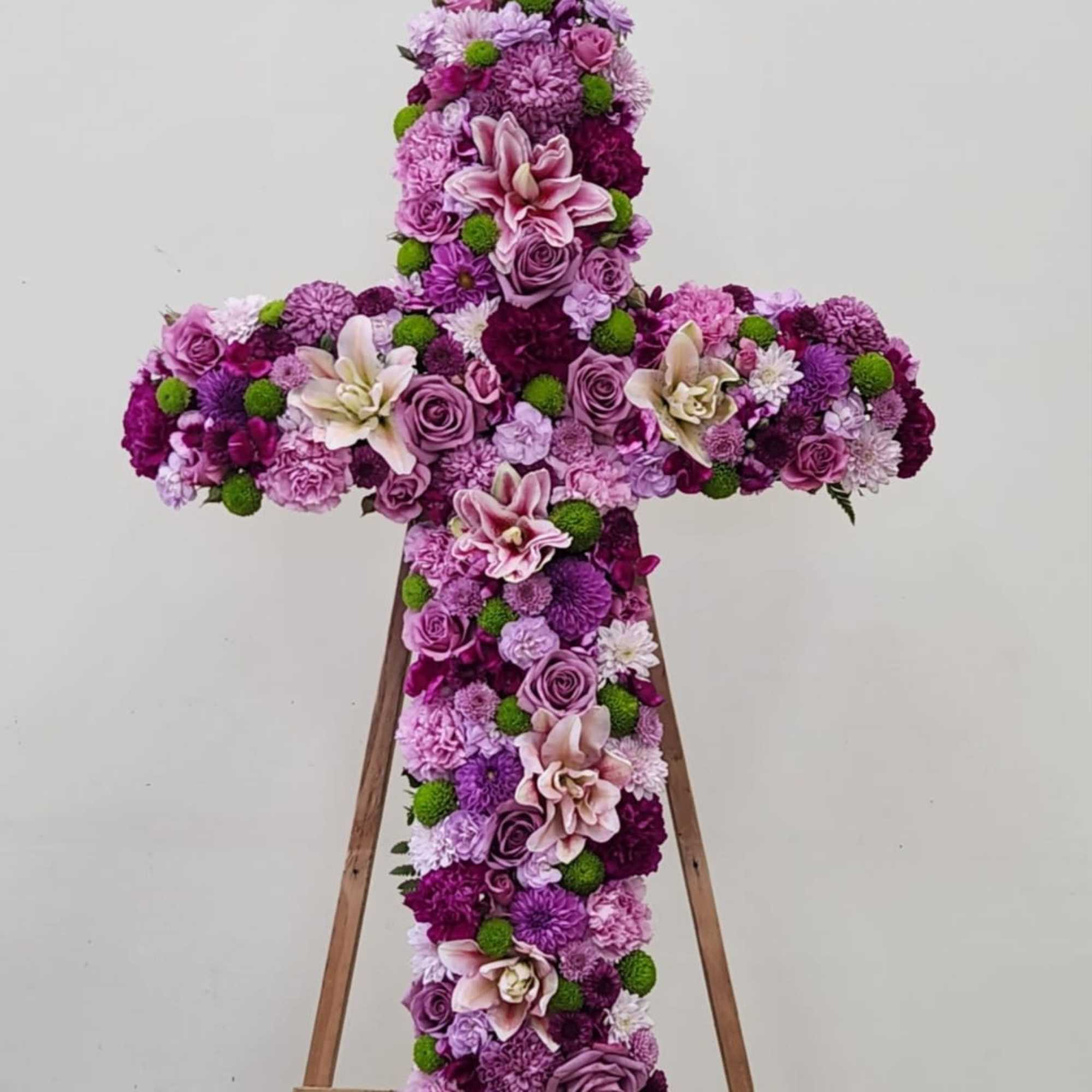 Celebrate a life well-lived with this stunning memorial cross, crafted from an