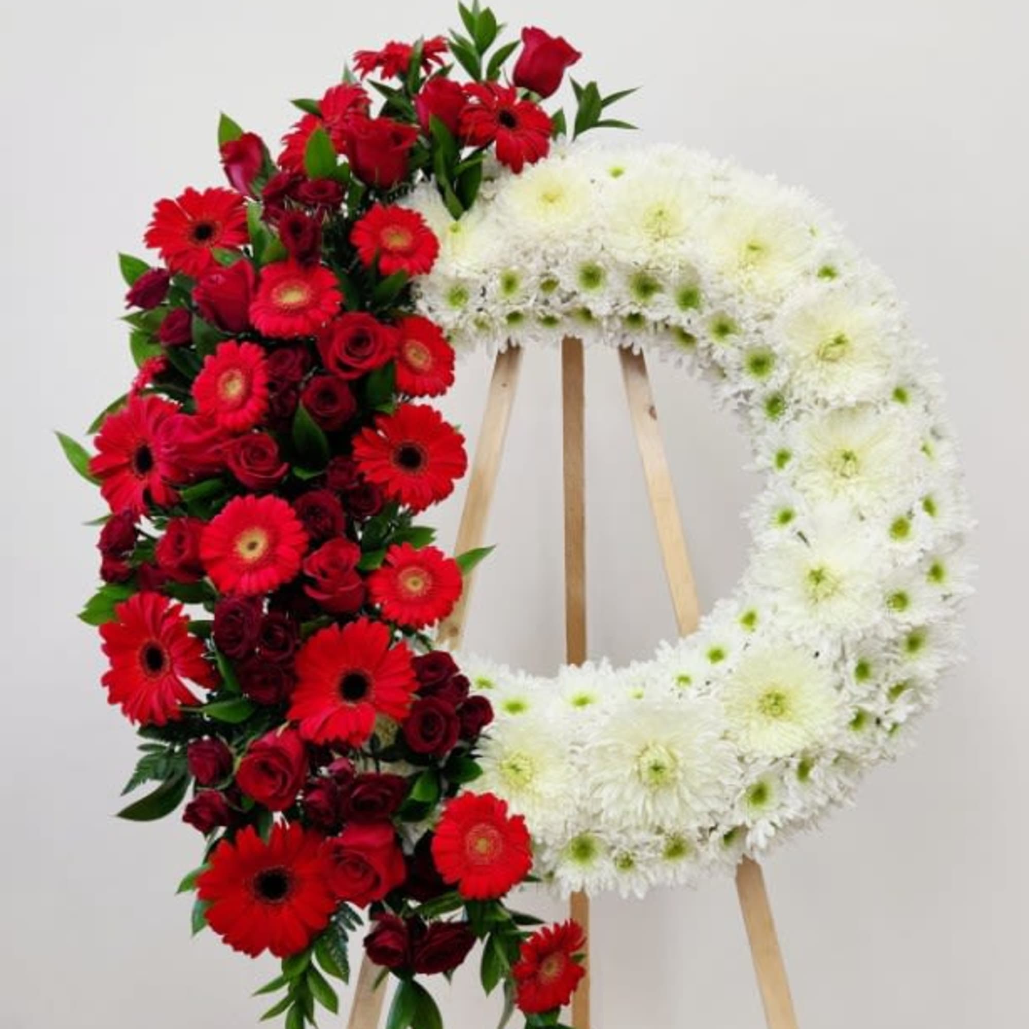 The Sweet Remembrance Wreath offers a graceful tribute, blending delicate textures to