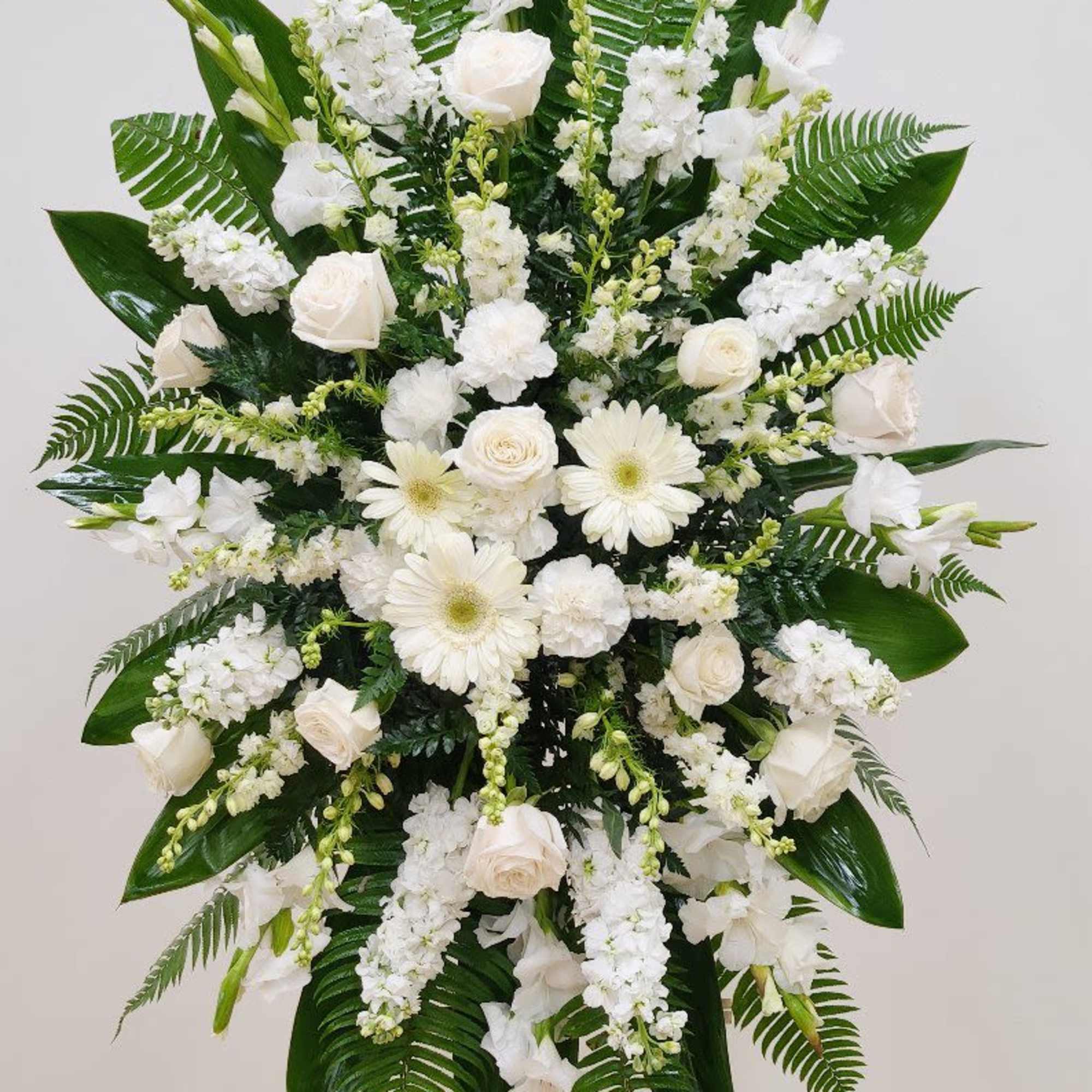 Express your heartfelt condolences with the Forever Respected Standing Spray, a tasteful