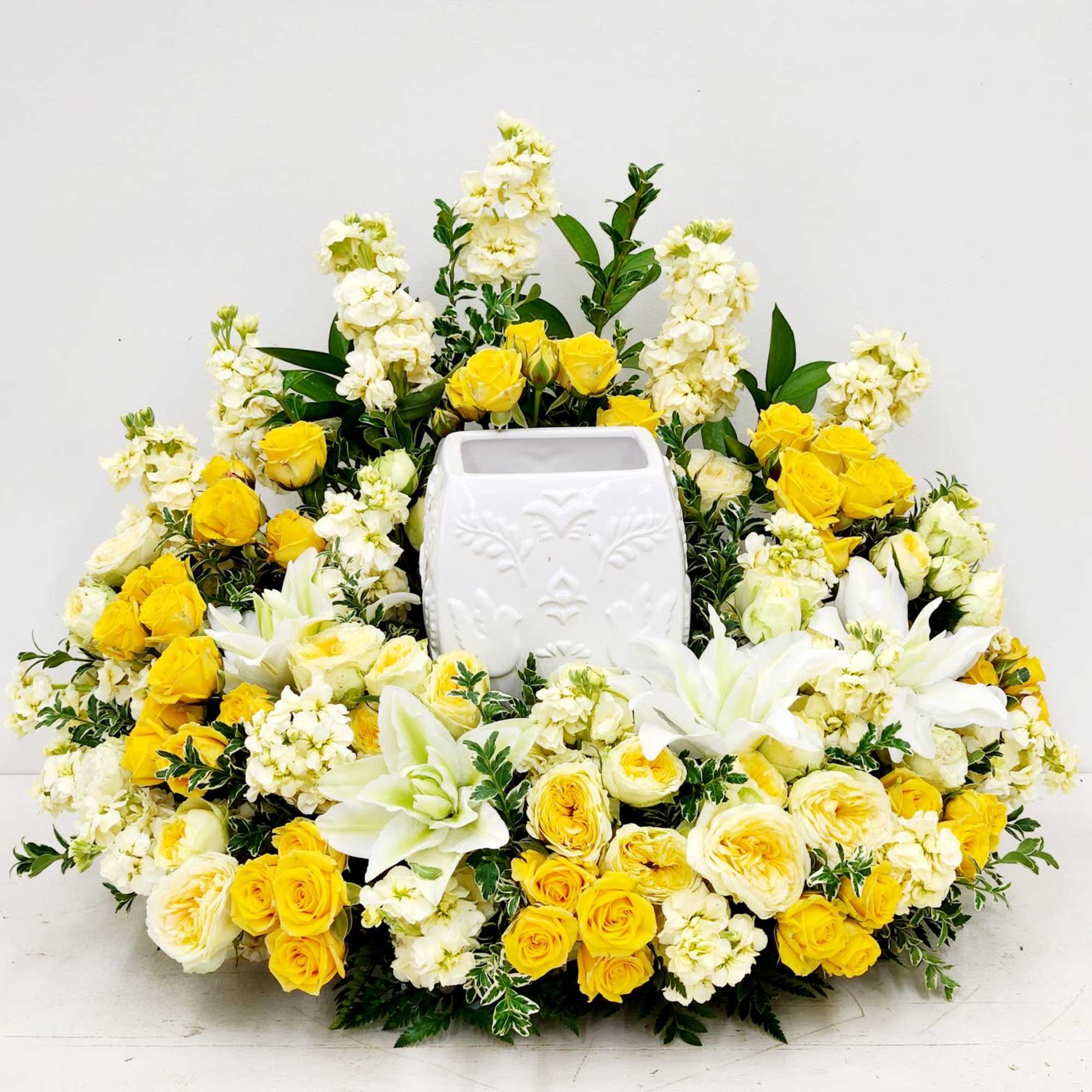 Celestial Light captures the warmth of remembrance with luminous yellow spray roses