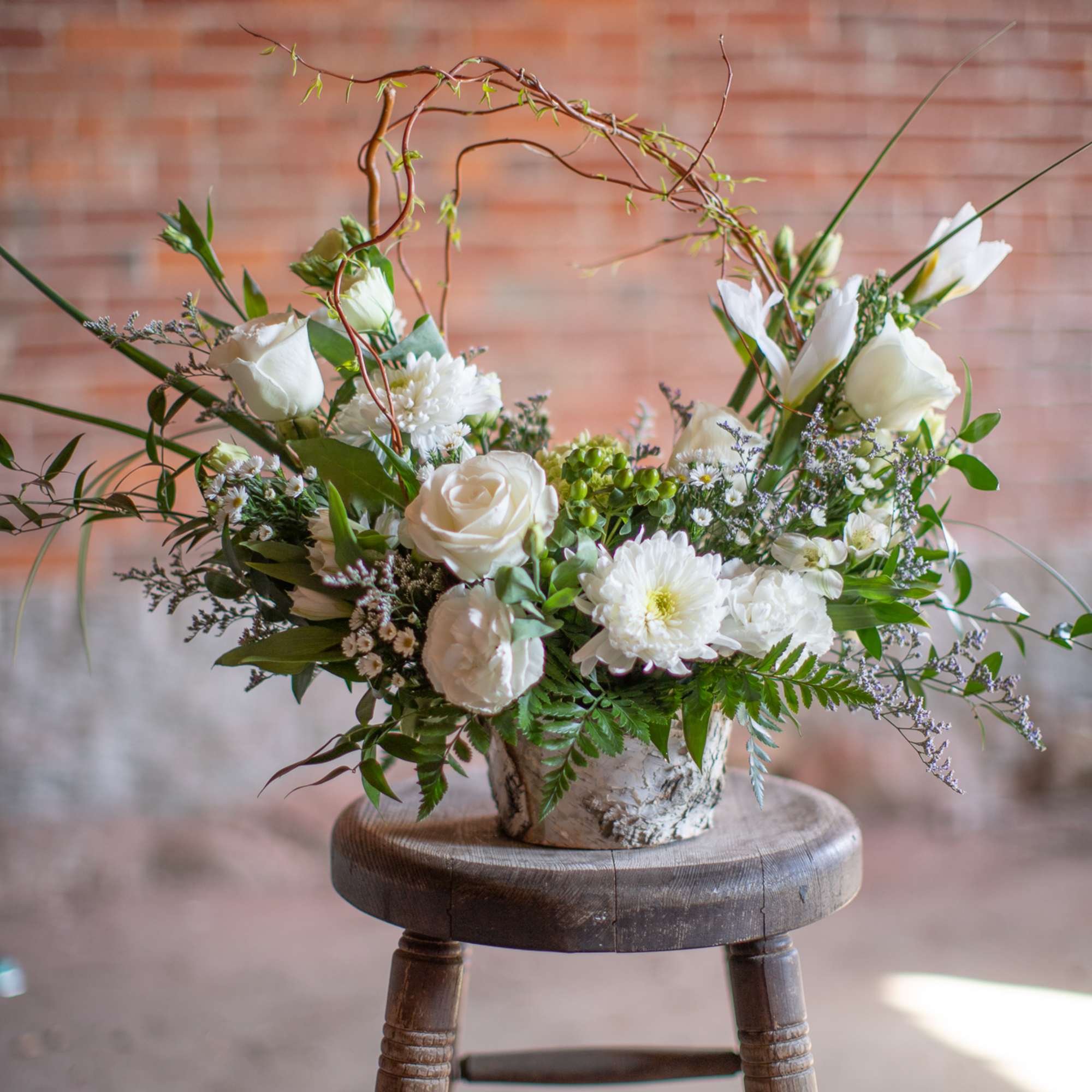 A beautiful sentiment of white or pastel toned floral varieties are designed