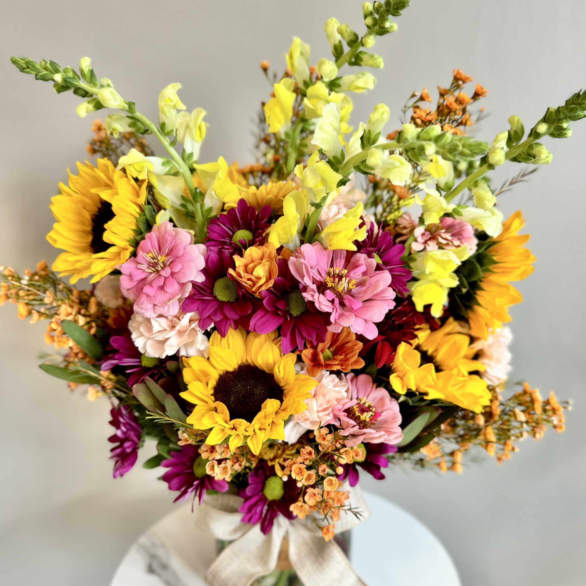 A one-of-a-kind arrangement designed with the freshest seasonal blooms, thoughtfully crafted to