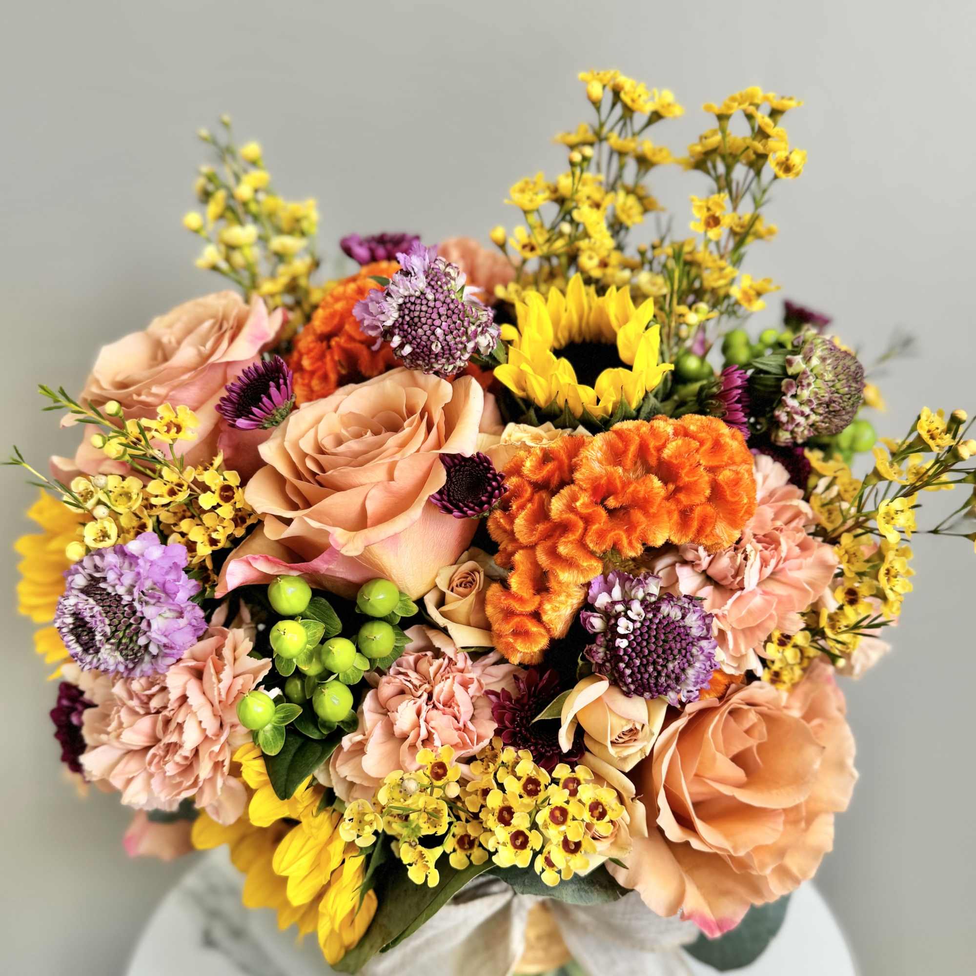 A one-of-a-kind arrangement designed with the freshest seasonal blooms, thoughtfully crafted to