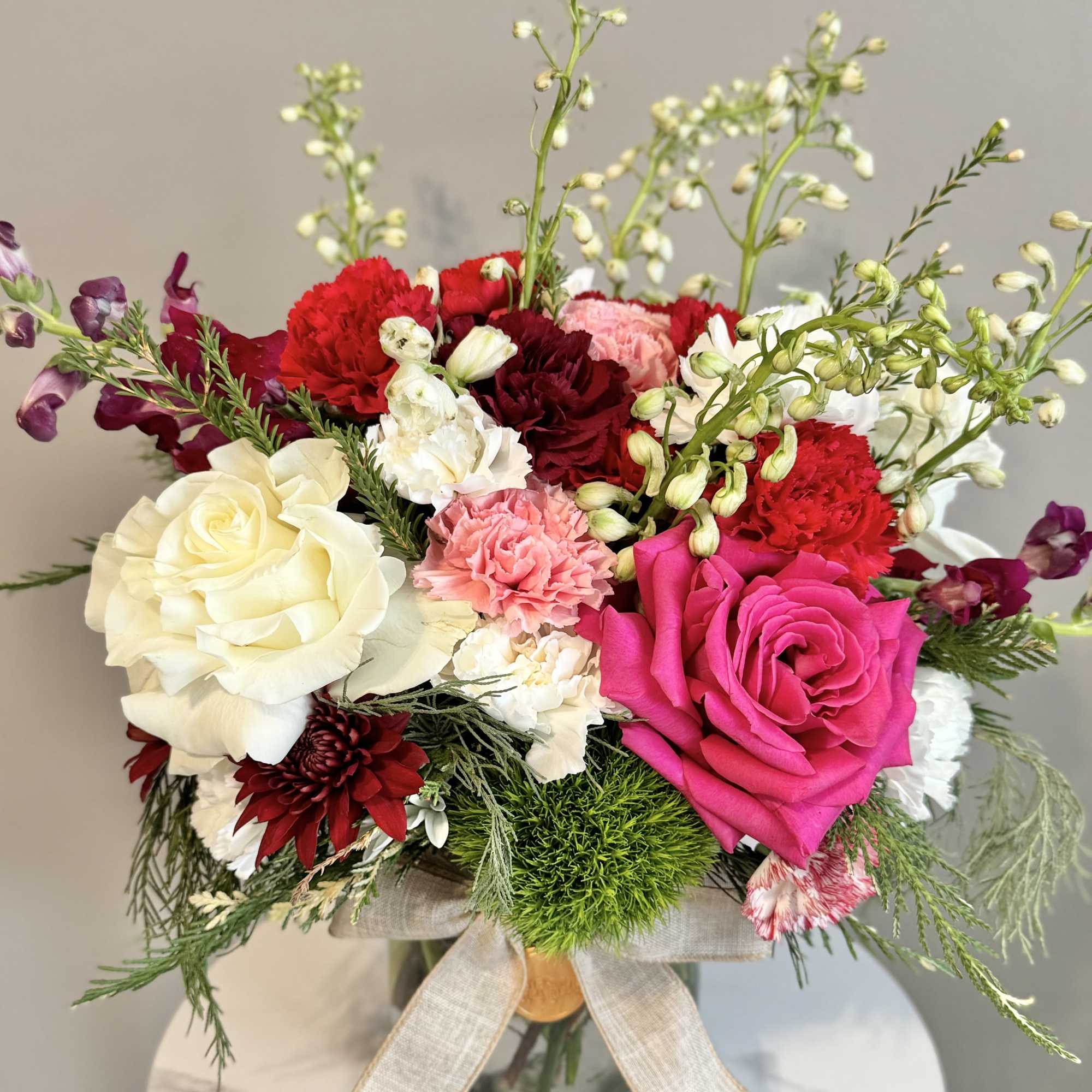 A one-of-a-kind arrangement designed with the freshest seasonal blooms, thoughtfully crafted to
