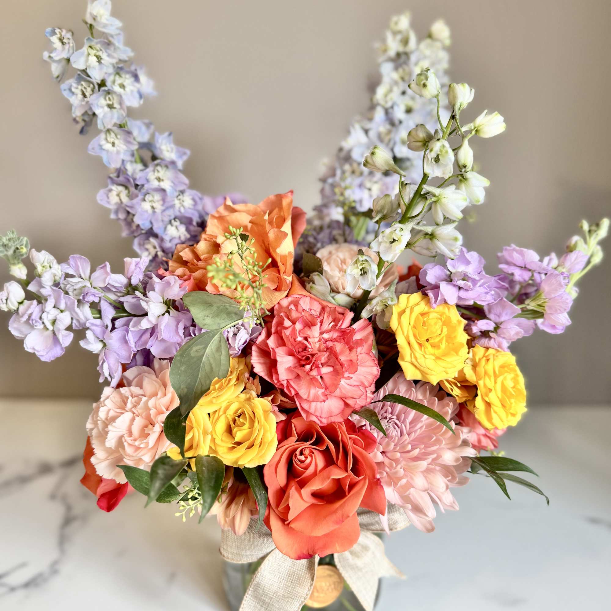 A one-of-a-kind arrangement designed with the freshest seasonal blooms, thoughtfully crafted to