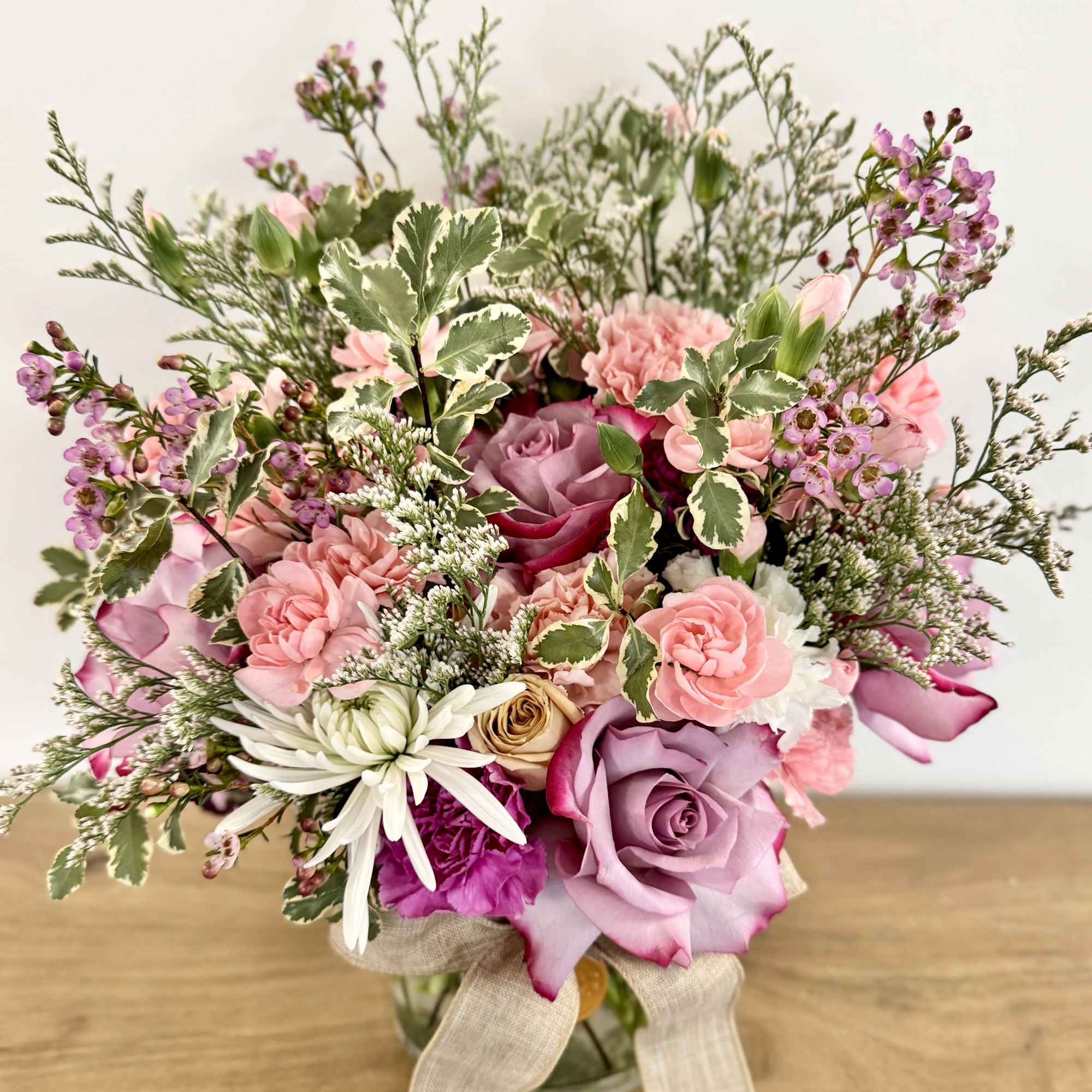 A one-of-a-kind arrangement designed with the freshest seasonal blooms, thoughtfully crafted to