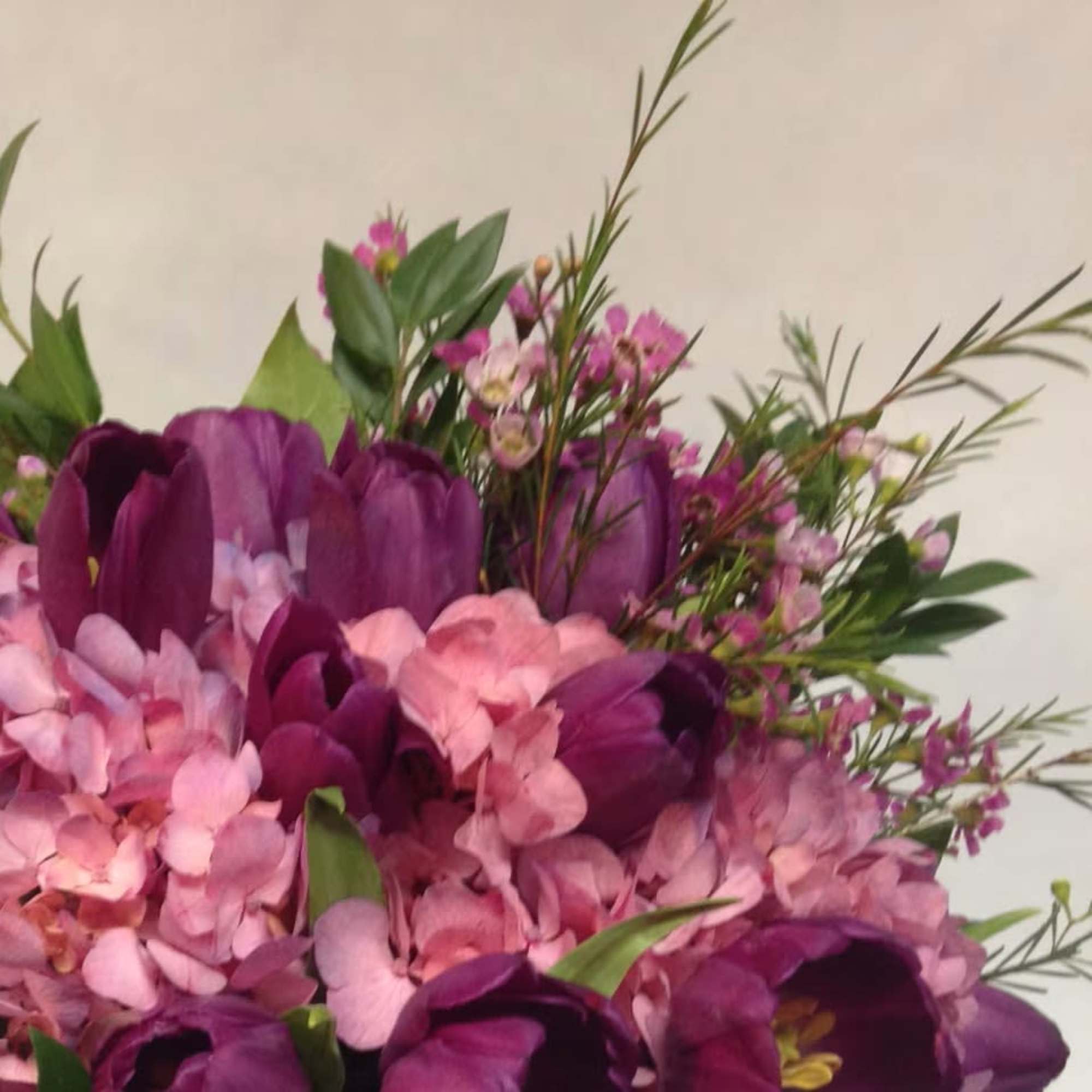 Bright, cheerful, and brimming with natural charm, this abundant floral arrangement is