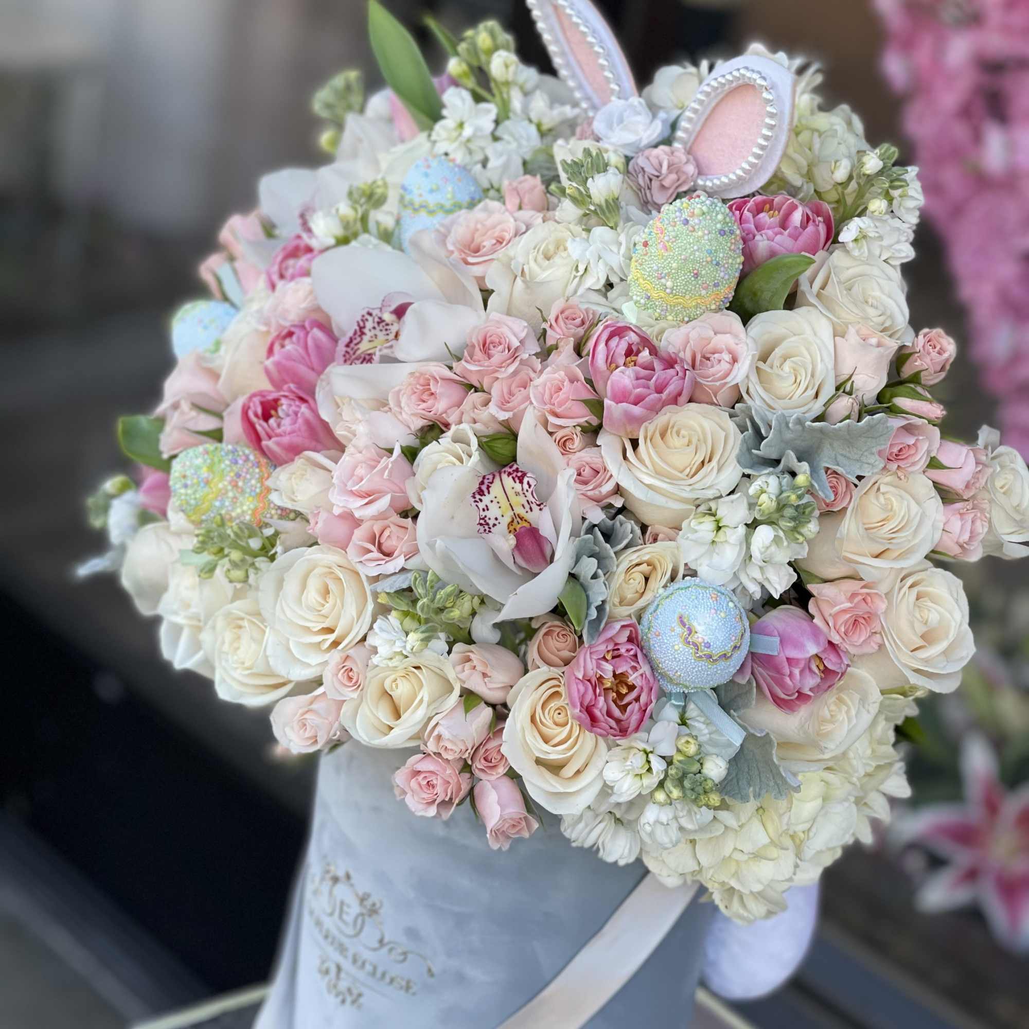Bunny ears and eggs included in the arrangement  