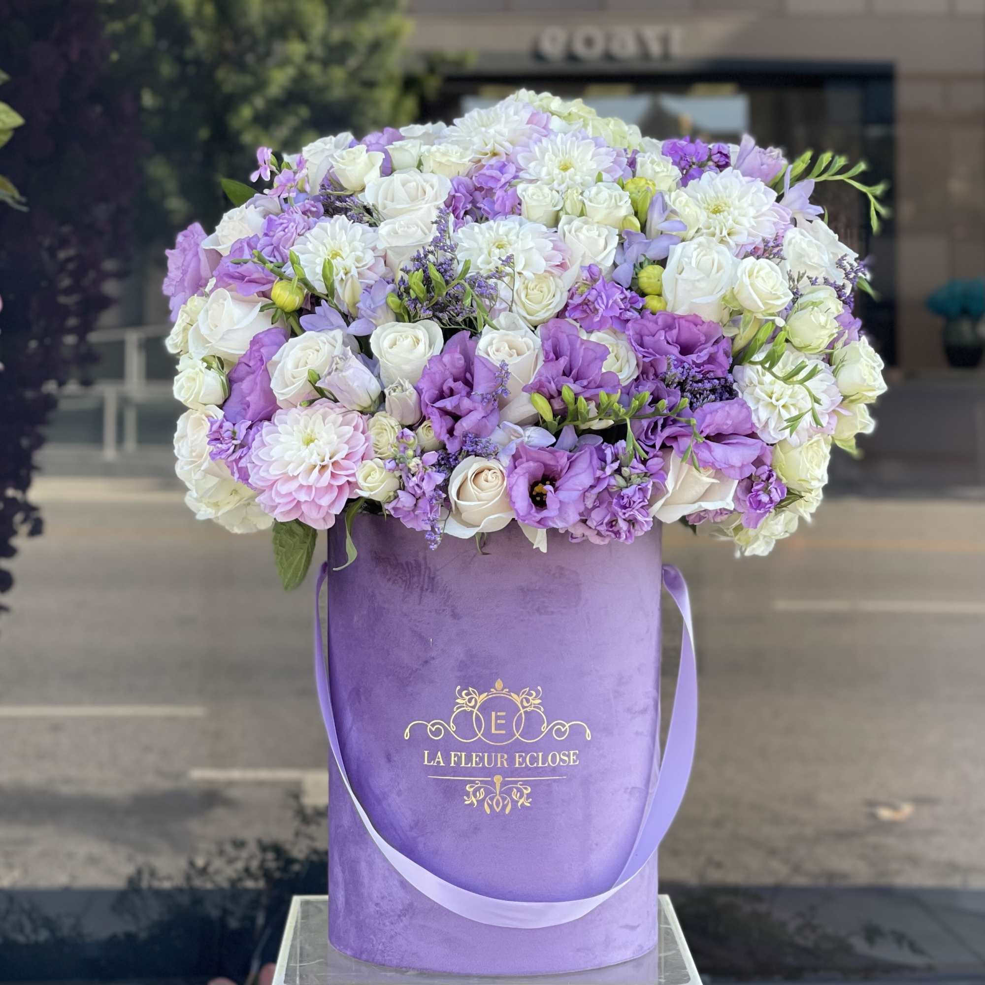 Beautiful arrangement of fresh flowers in our signature lavender velvet box 