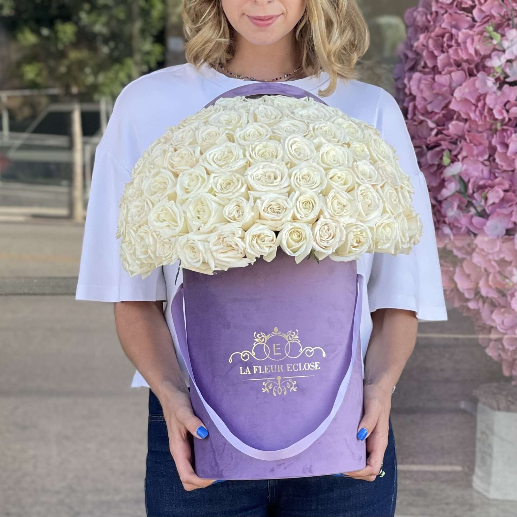 50 white roses in our signature velvet lavender box   