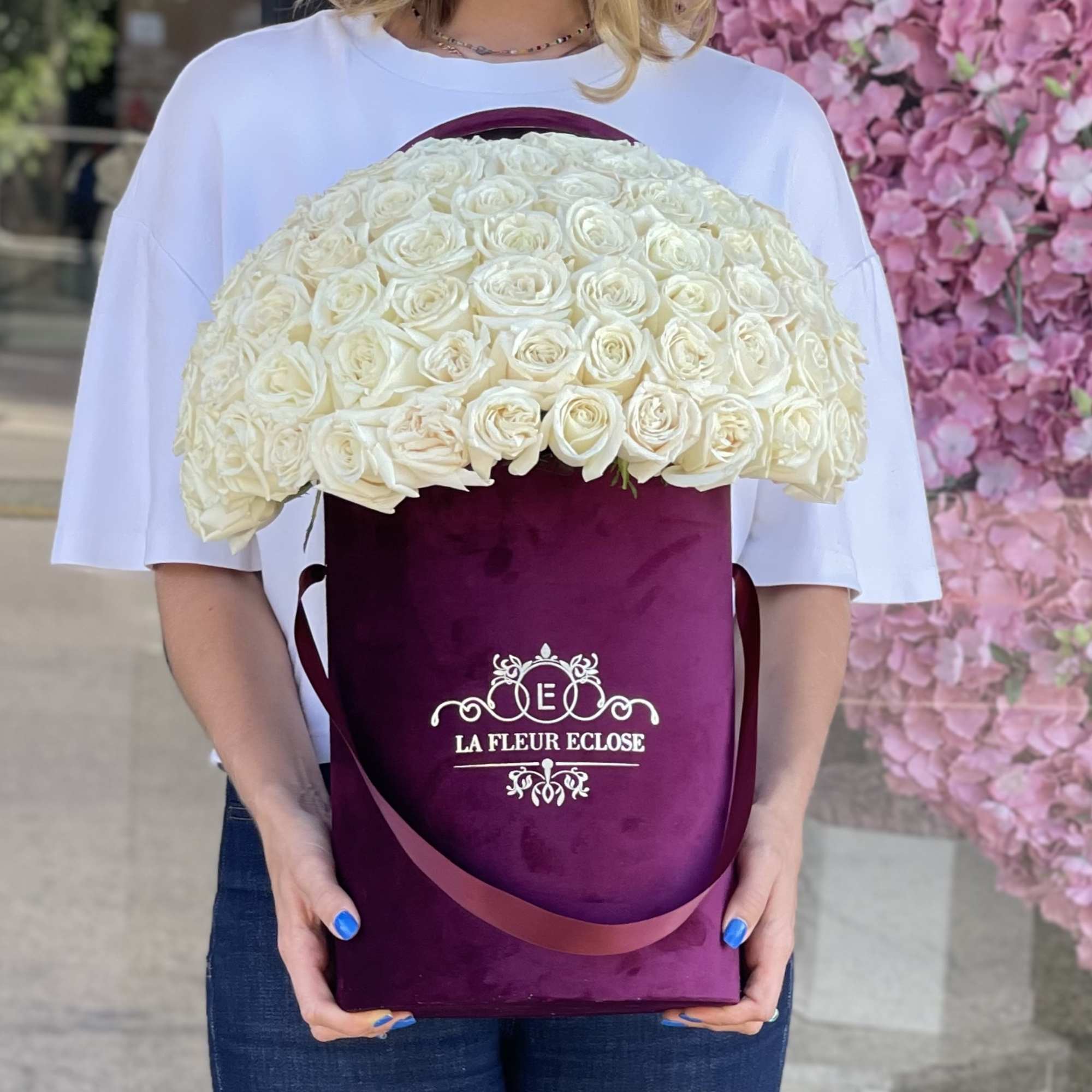 60 white roses in our signature velvet burgundy box 