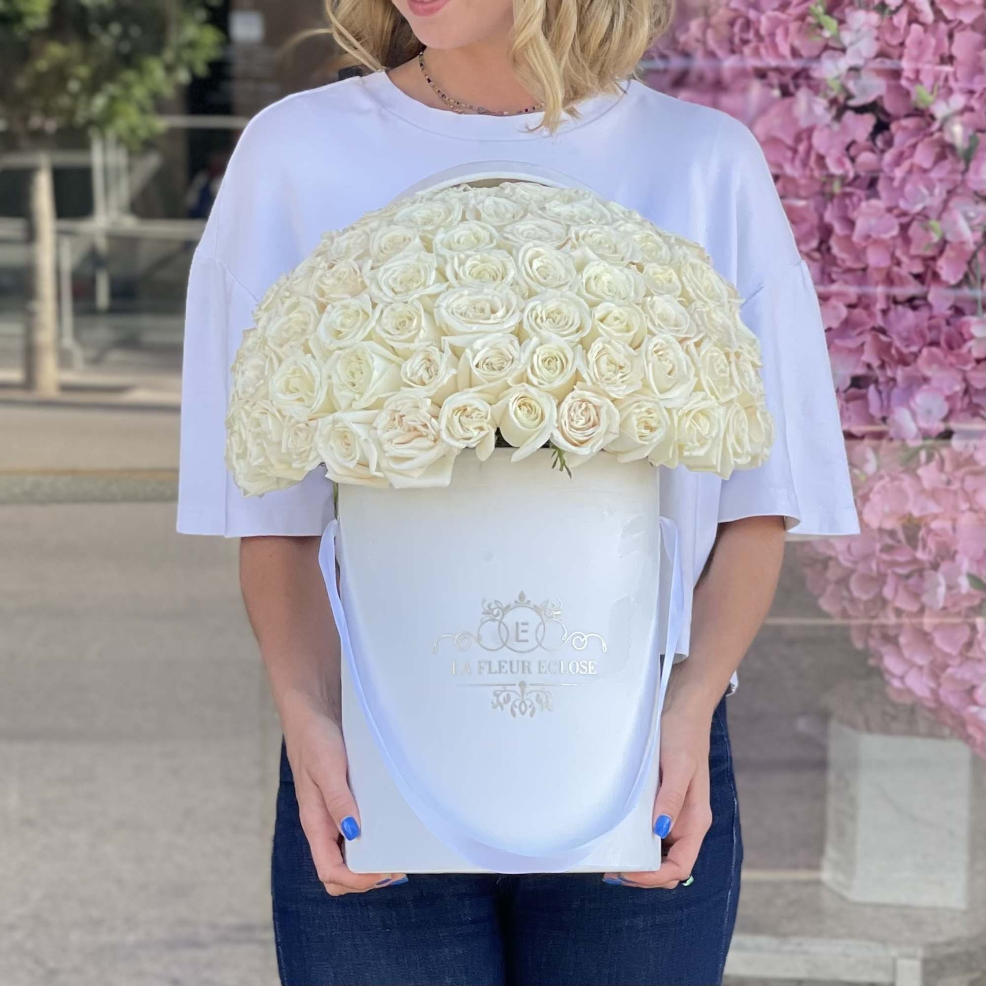 50 white roses in our signature velvet white box   