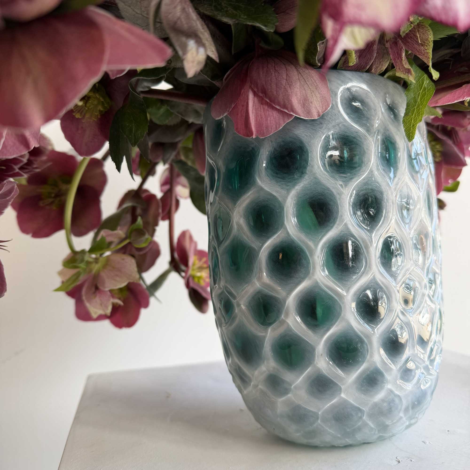 helleborus' delicately cupped, nodding heads and big, jagged edged leaves are sometimes