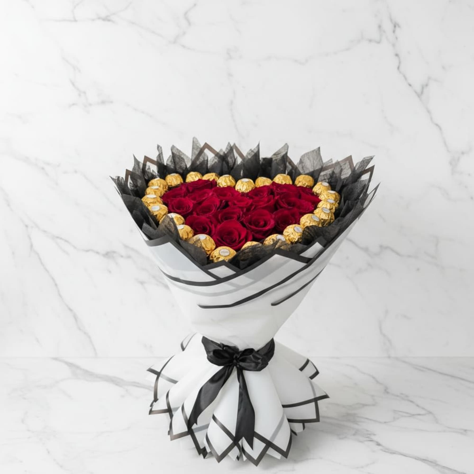 Includes fresh red roses and authentic Ferrero Rocher chocolates. The design of