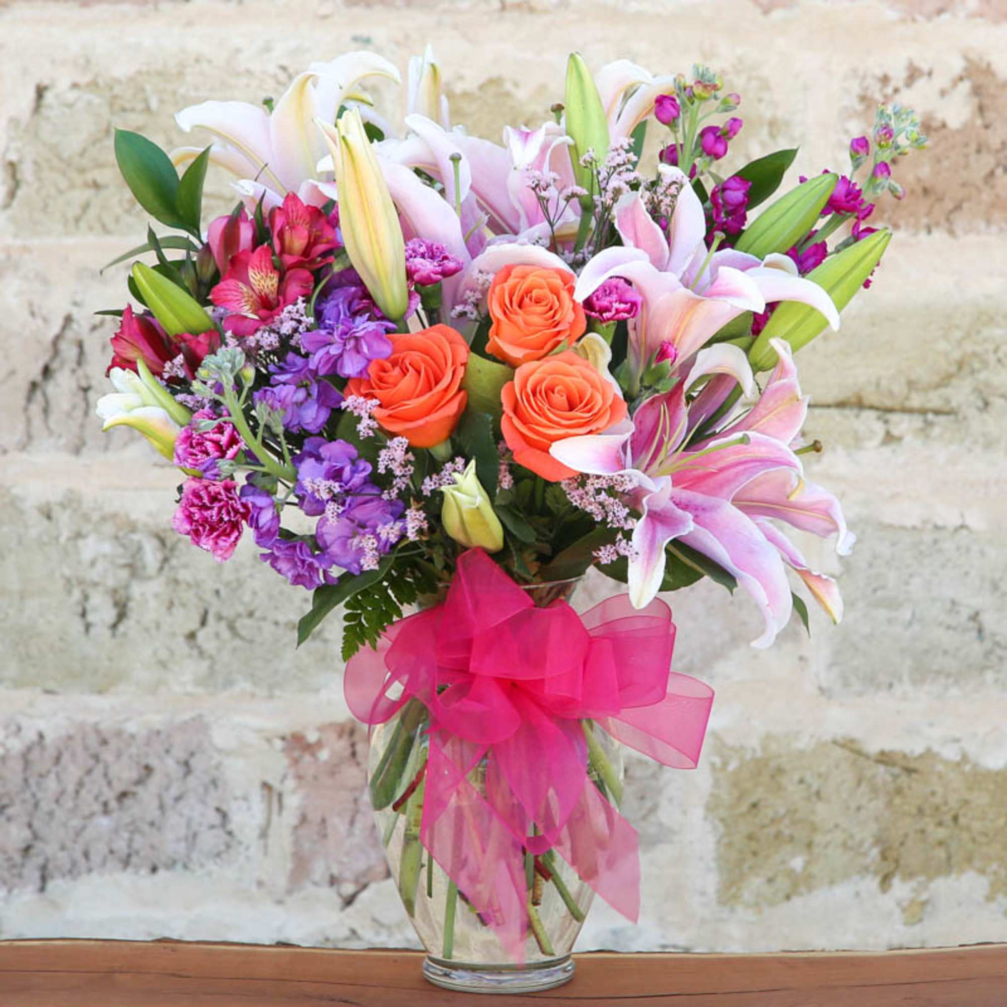 SHOW HER SHE'S #1 WITH THIS BEAUTIFUL ARRANGEMENT OF PINK OR
WHITE LILIES