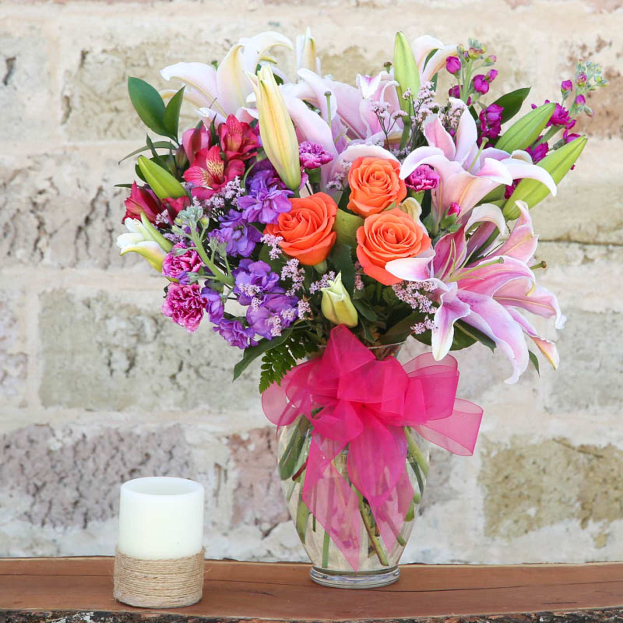 SHOW HER SHE'S #1 WITH THIS BEAUTIFUL ARRANGEMENT OF PINK OR
WHITE LILIES