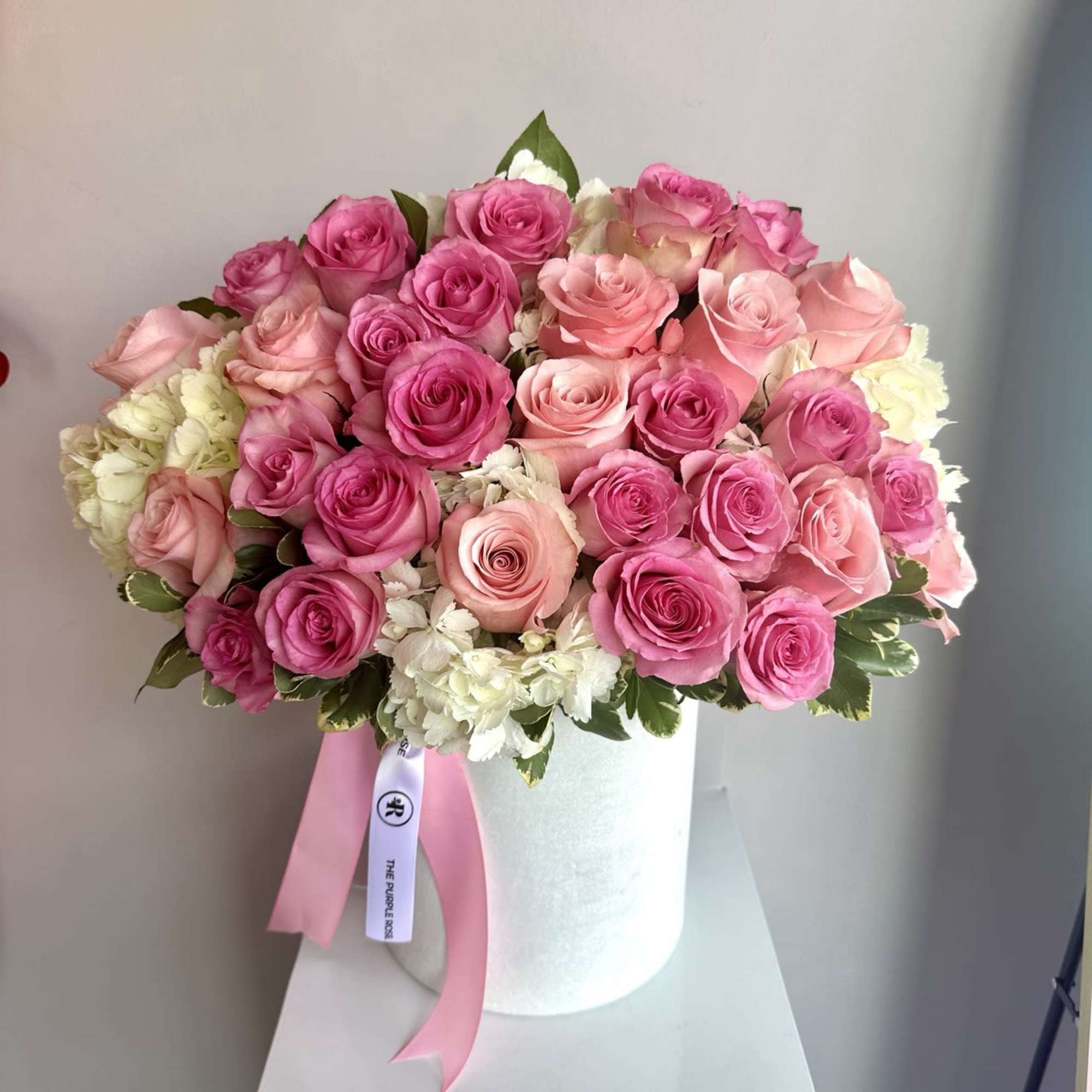 A charming arrangement with roses in two elegant shades of pink &mdash;