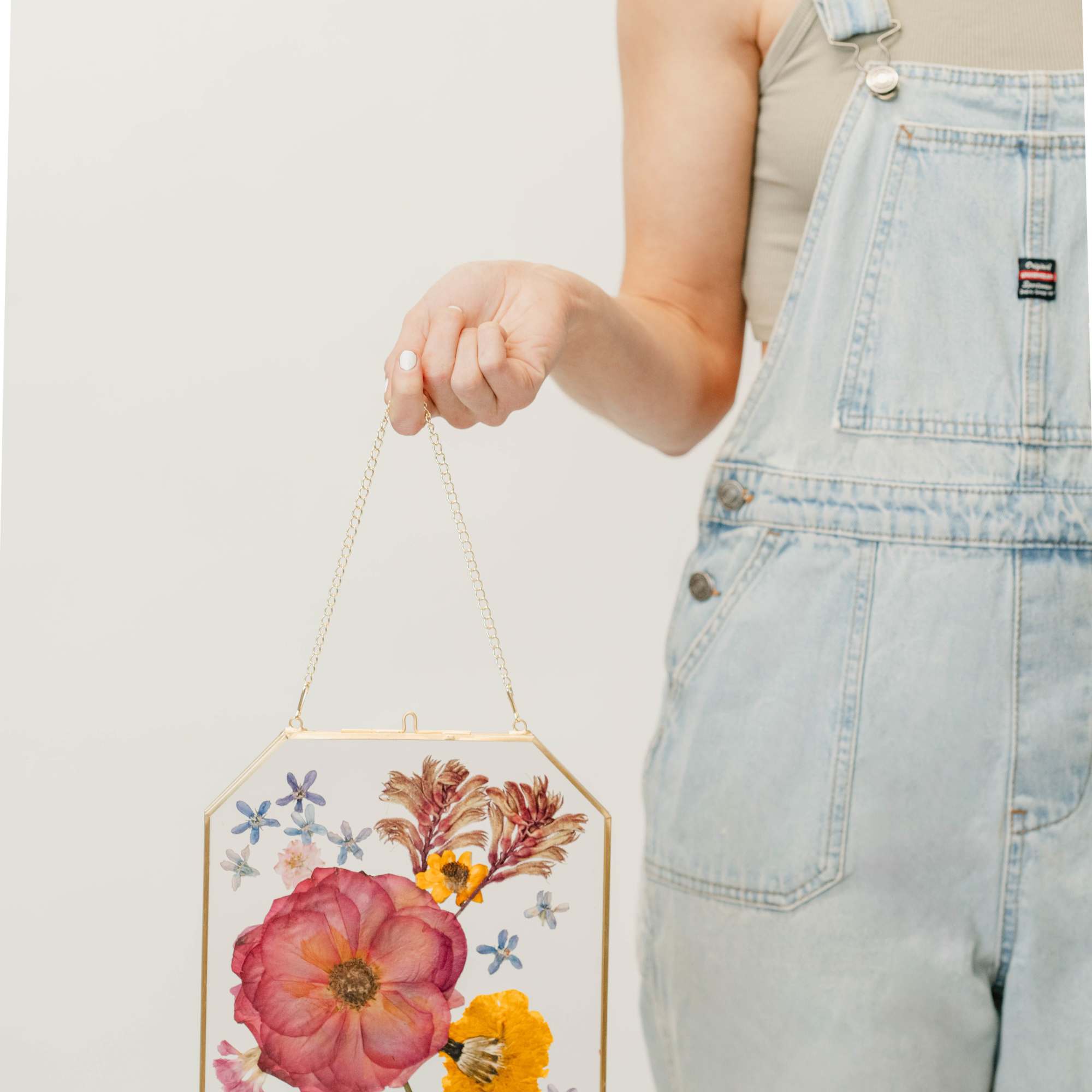 Capture the beauty of nature with our pressed flower frame, showcasing real