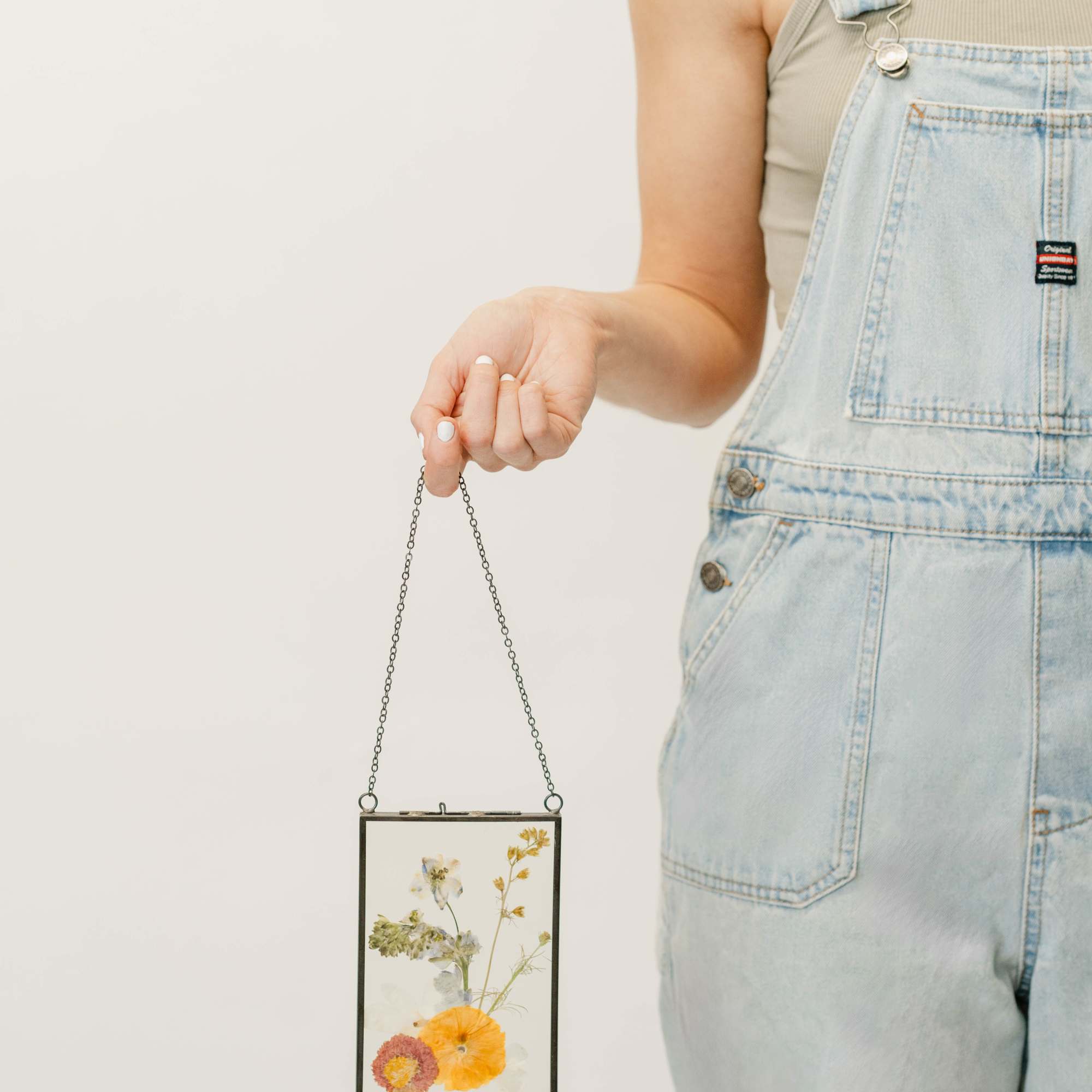 Capture the beauty of nature with our pressed flower frame, showcasing real