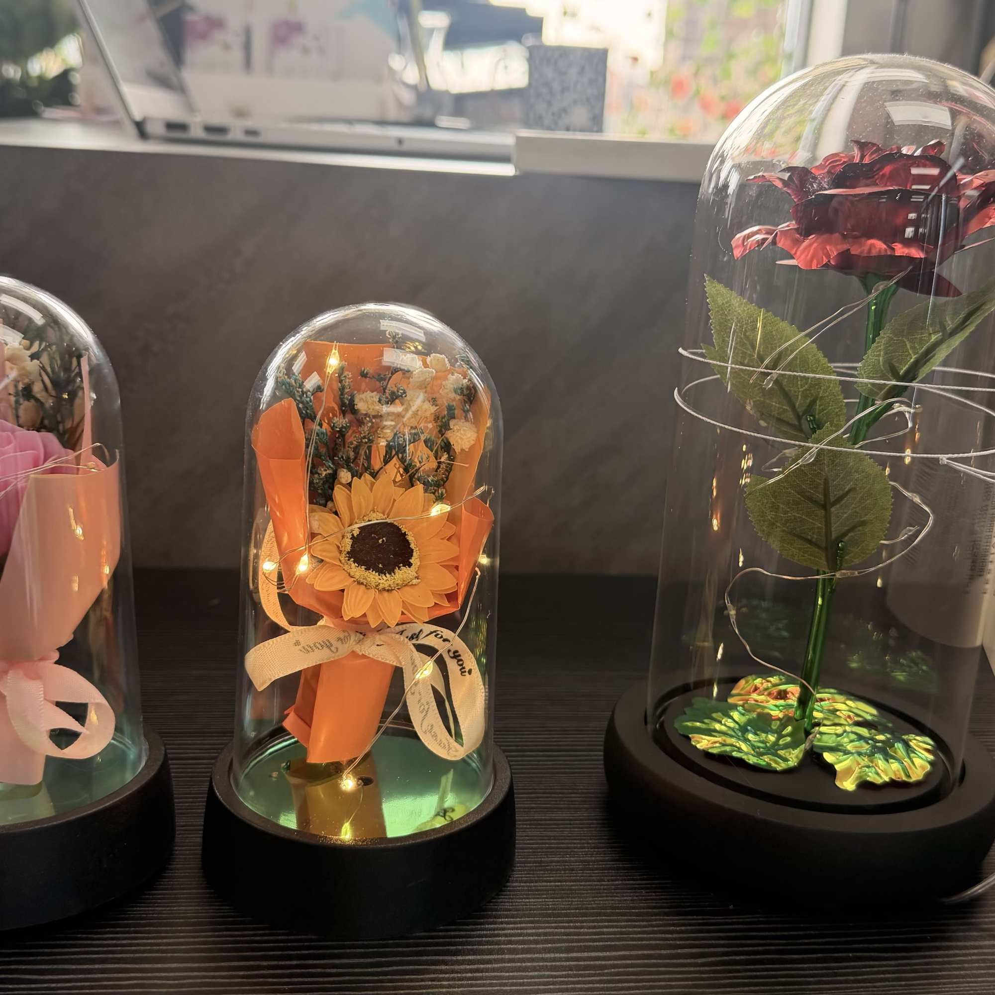 Elegant LED rose displayed in a glass dome with warm glowing lights