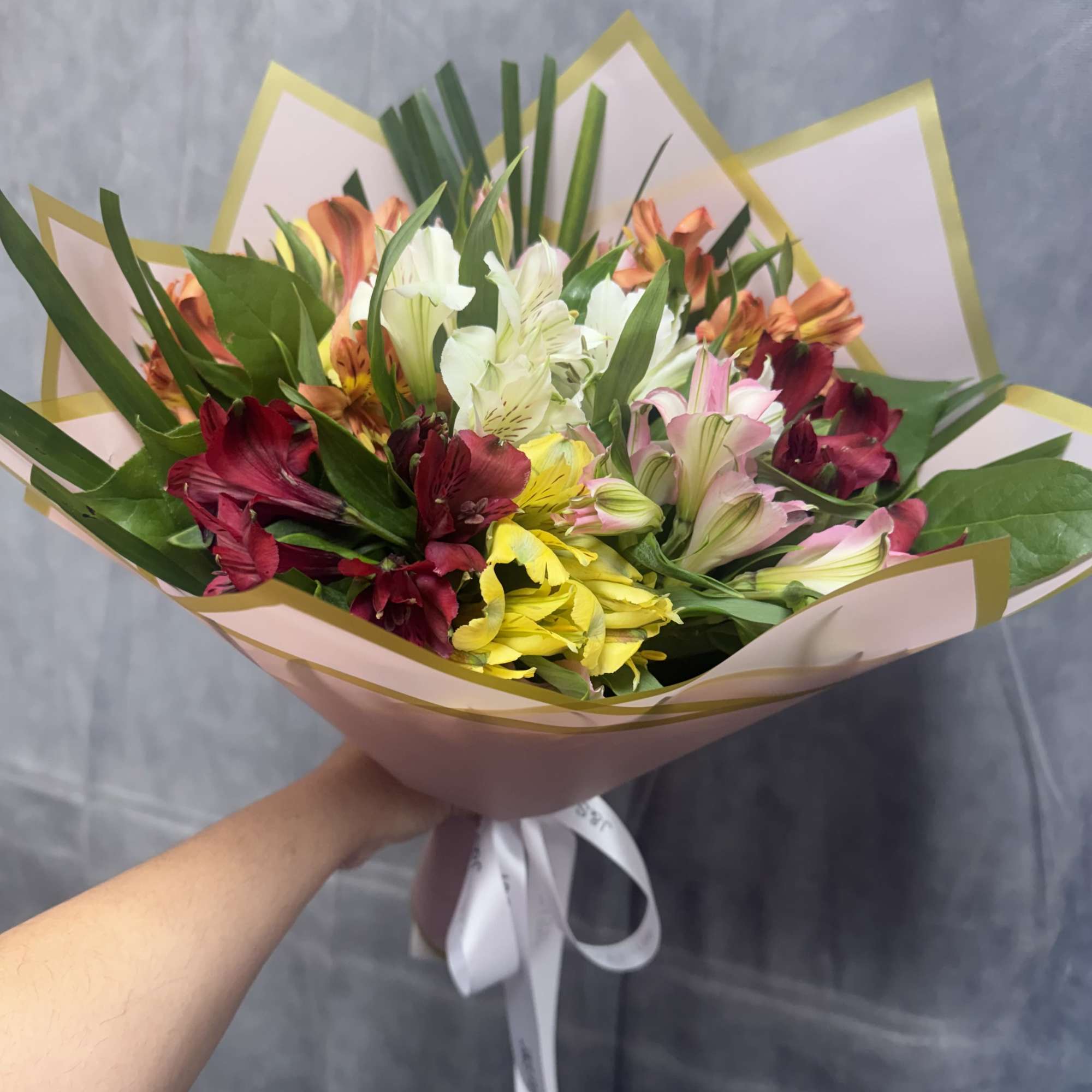 Introduction our alstroemerias lovers bouquet, beautifully arranged with greenery. 
Standard size has