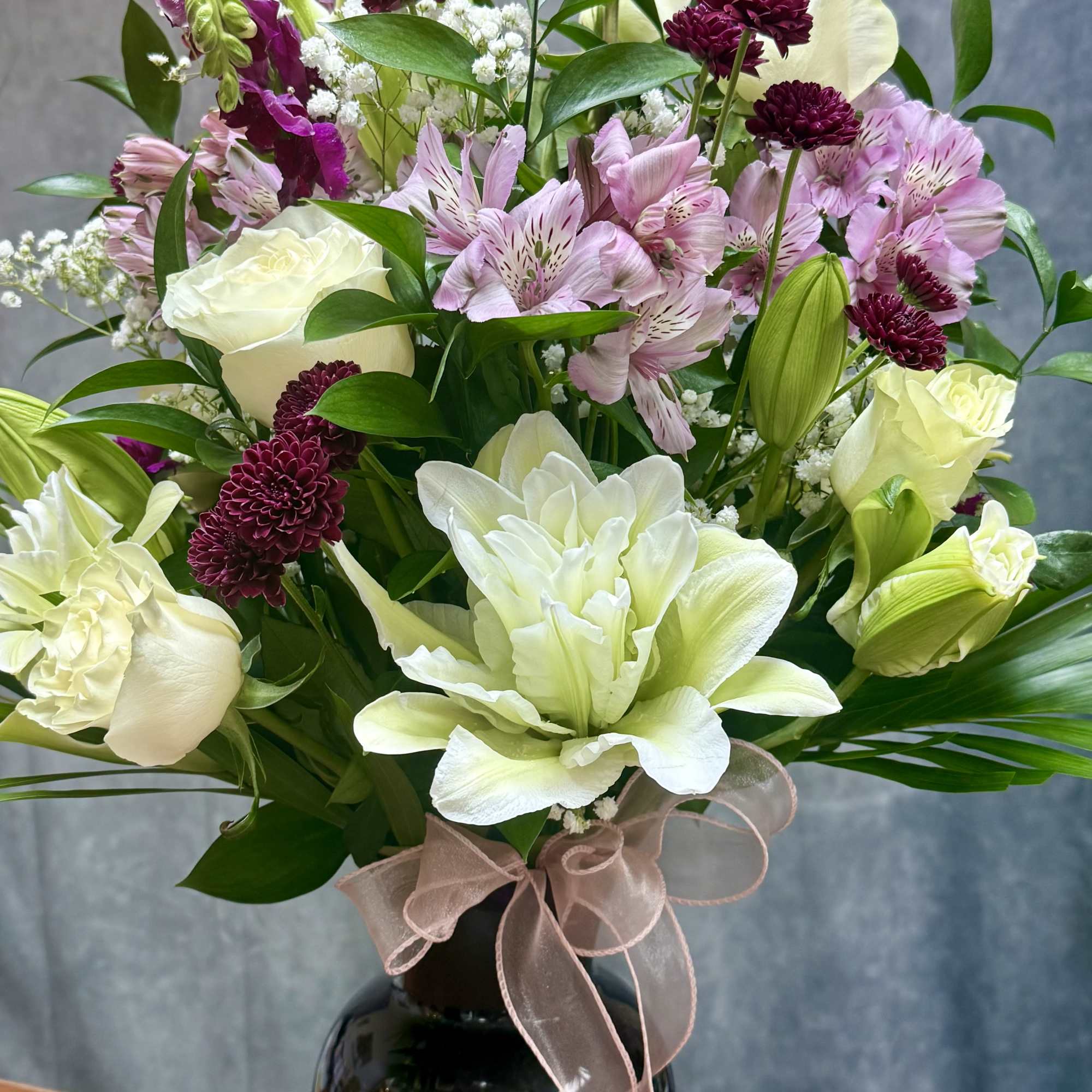 Our White and Purple Elegance Vase showcases a harmonious mix of pristine