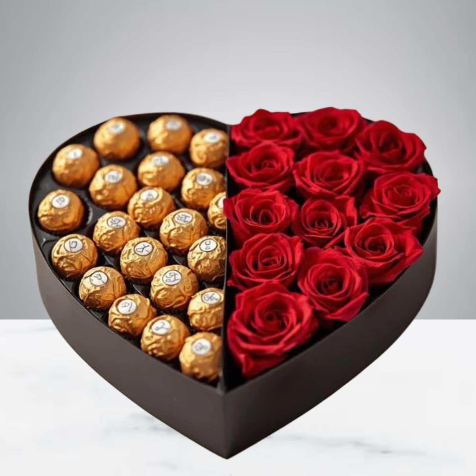This beautiful arrangement of roses and chocolates comes in a heart-shaped box.