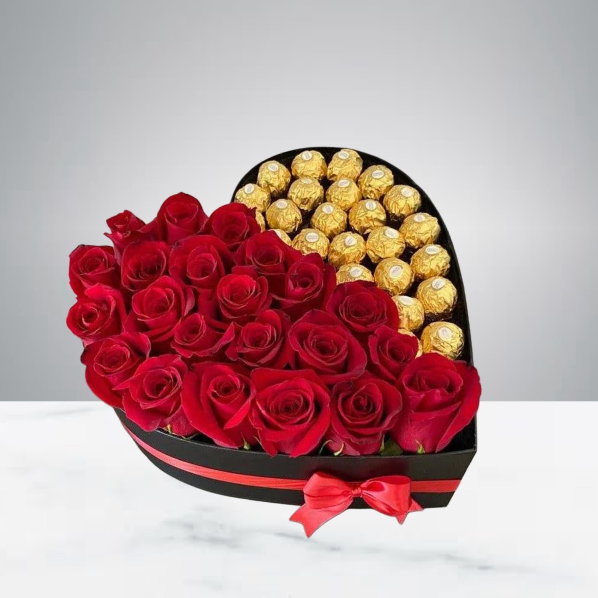 This beautiful arrangement of roses and chocolates comes in a heart-shaped box.