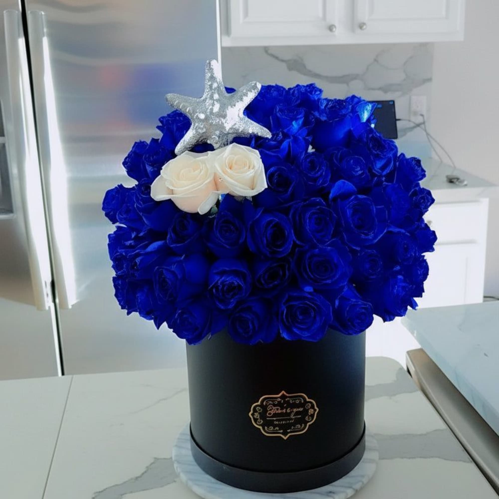 Beautiful Blue Flower Box designed by Yansa Flowers, a luxury florist creating