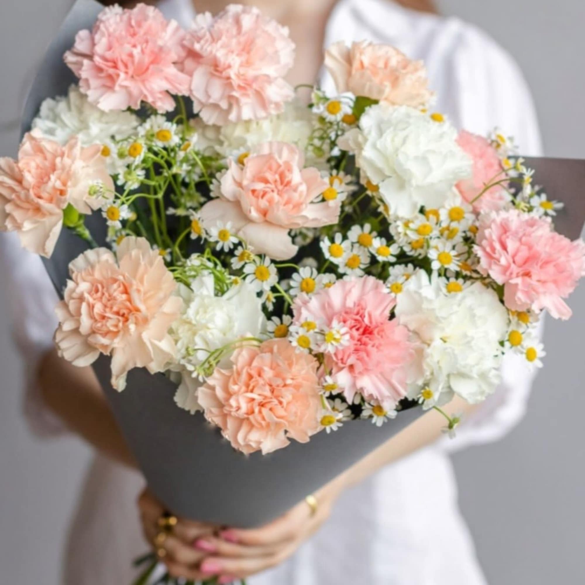 Bouquet of Carnation with mini Daisies.