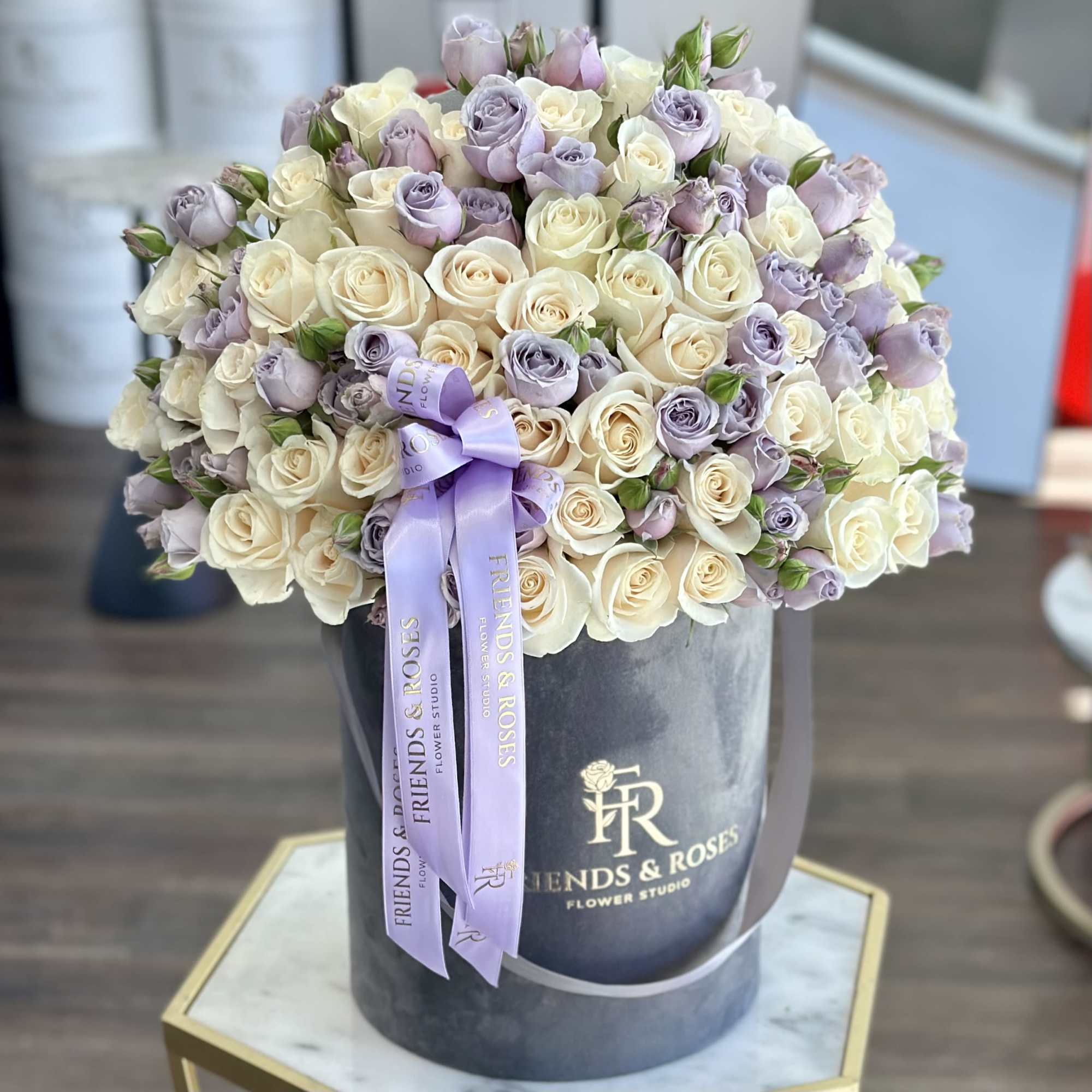 White and soft lavender roses come together in a refined harmony of