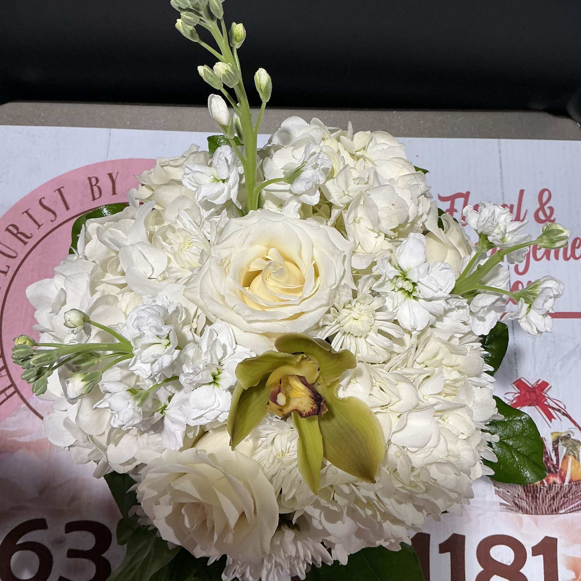 Send this all-white arrangement to the family's home to let them know