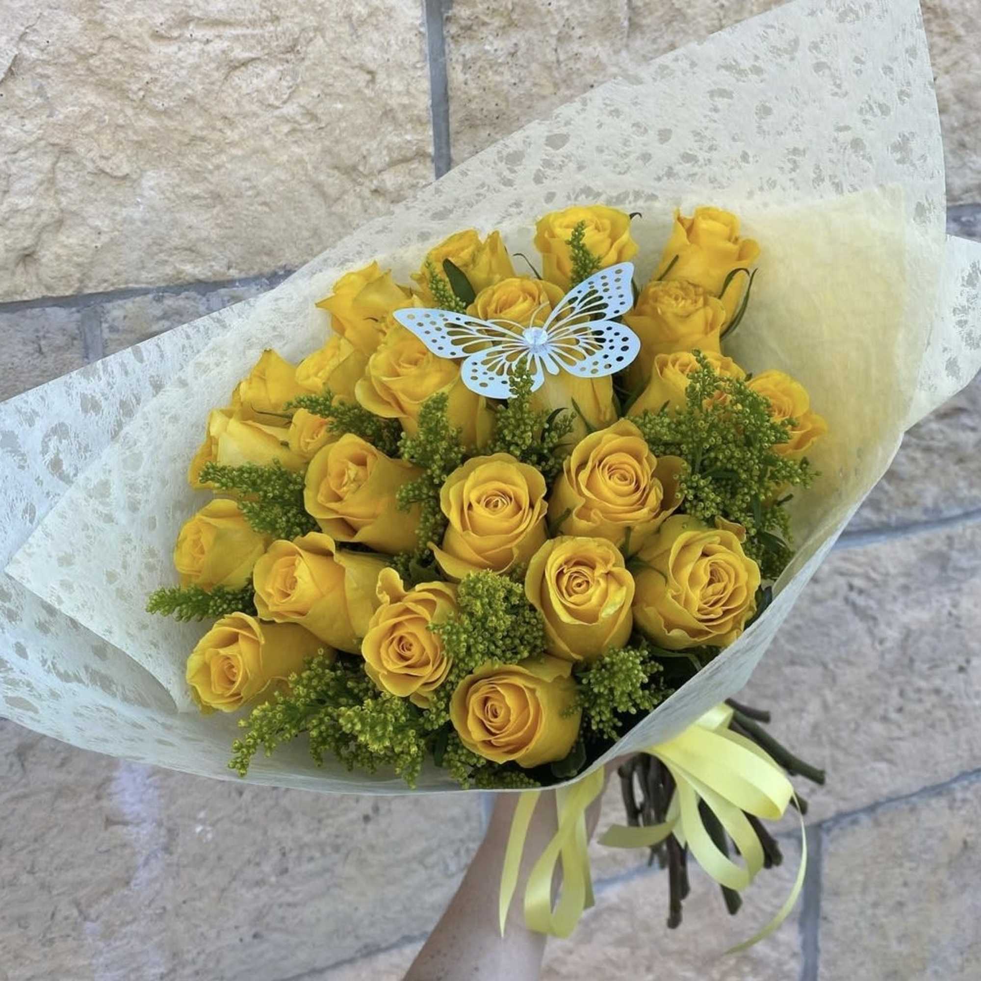 Yellow roses with a touch of solidago