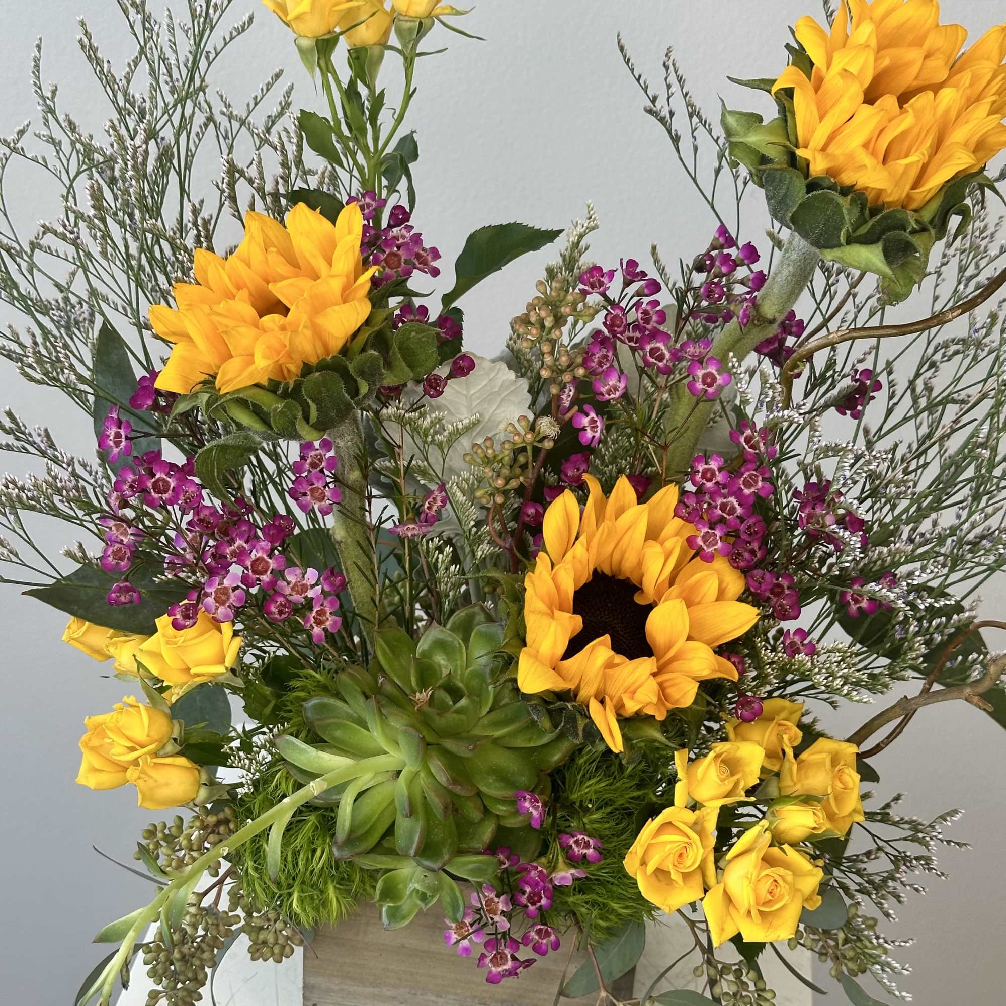 Discover the cheerful warmth of the Rustic Sunshine flower arrangement. This beautiful