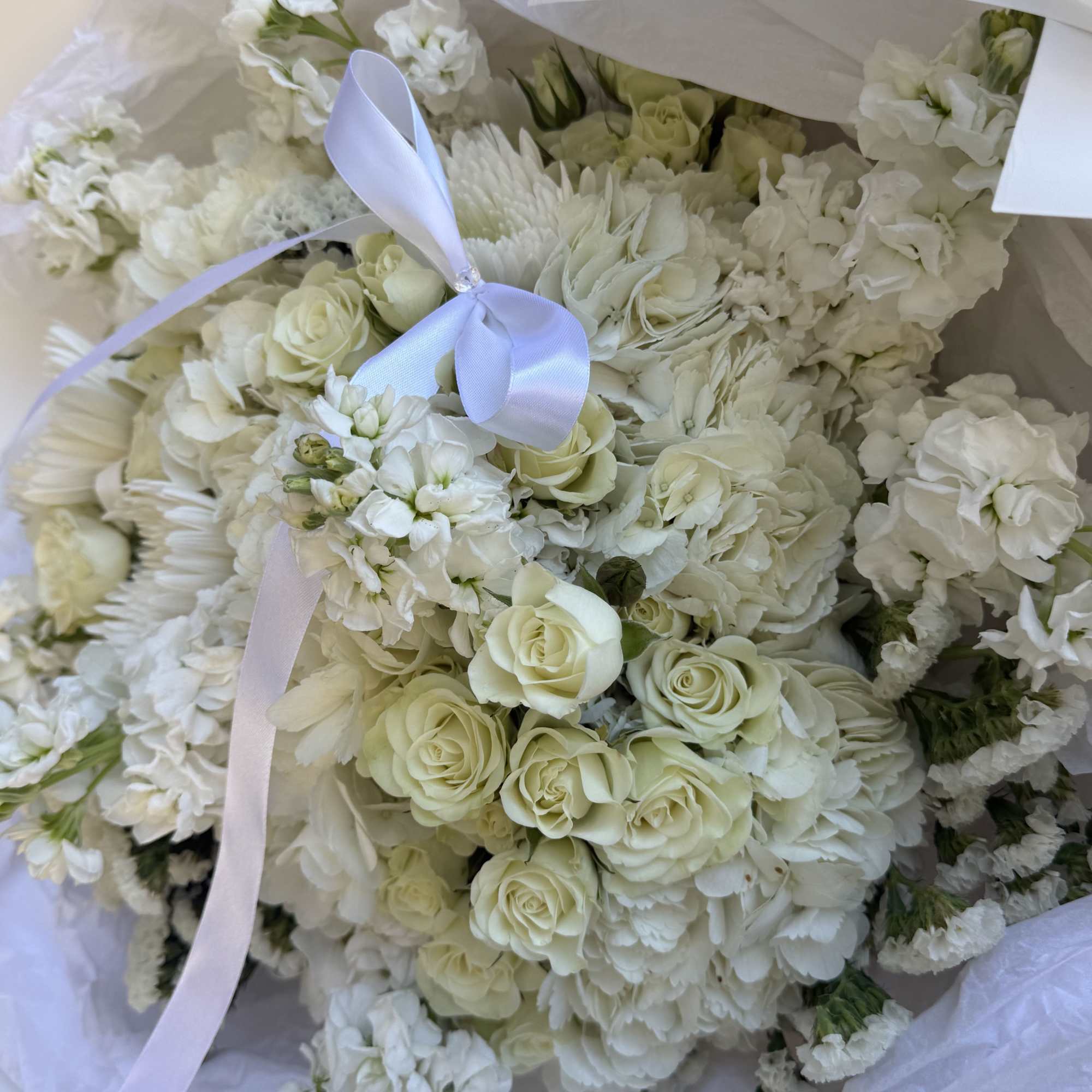A serene and elegant all-white bouquet, Morning Sky features a delicate mix