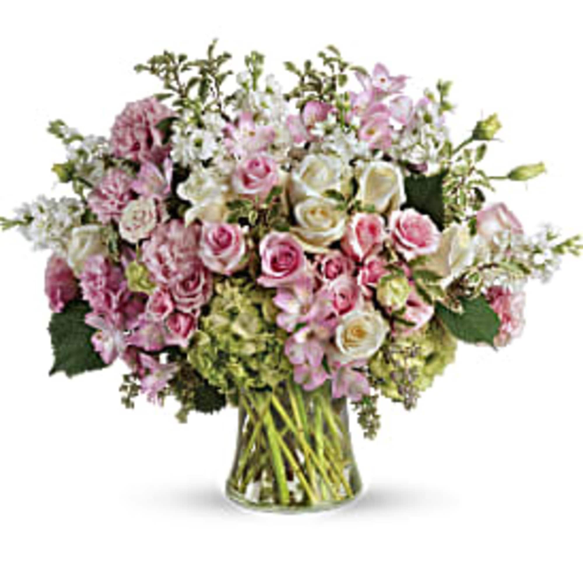 Pink and white mixed flower bouquet in a clear glass vase