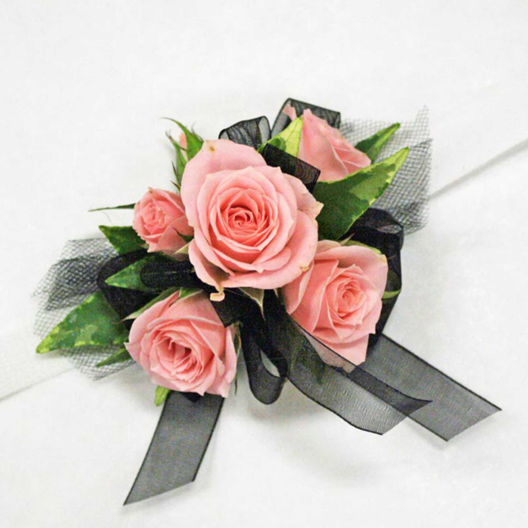 Enhance your look with our contemporary, petite-style wristlet featuring spray roses. Designed