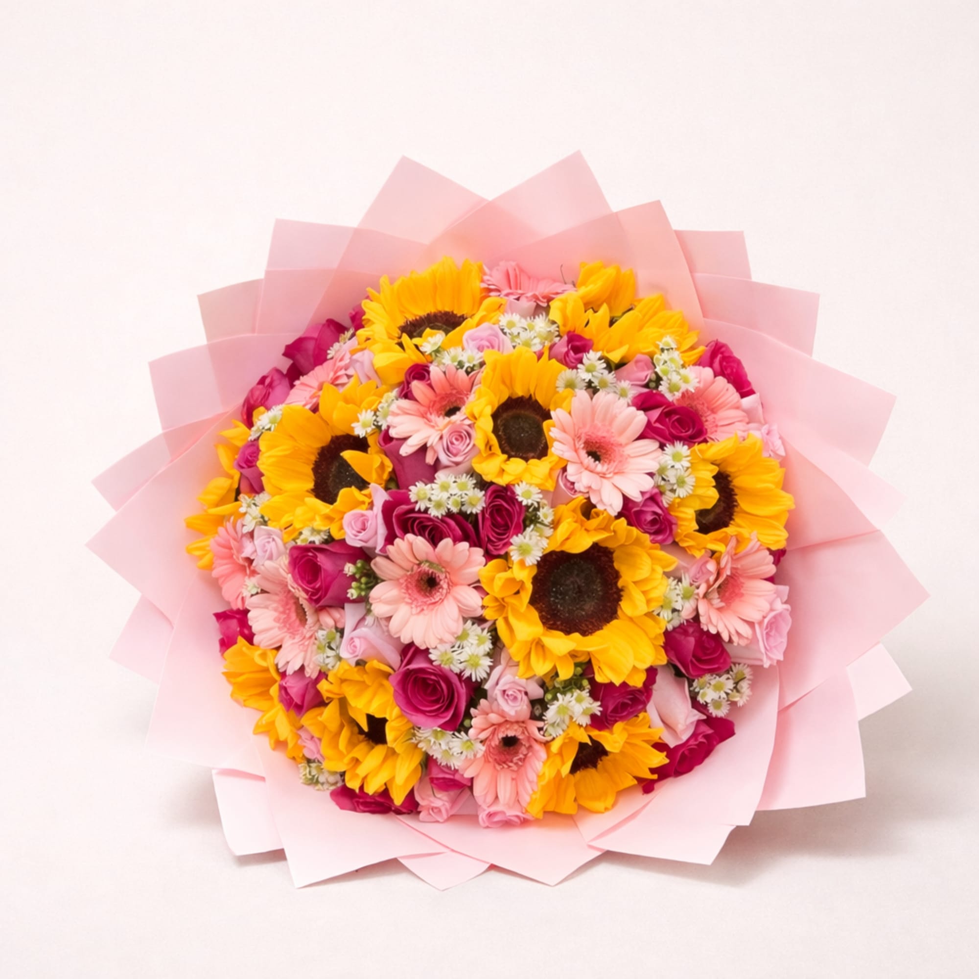 A vibrant bouquet that radiates warmth and joy. This arrangement combines radiant