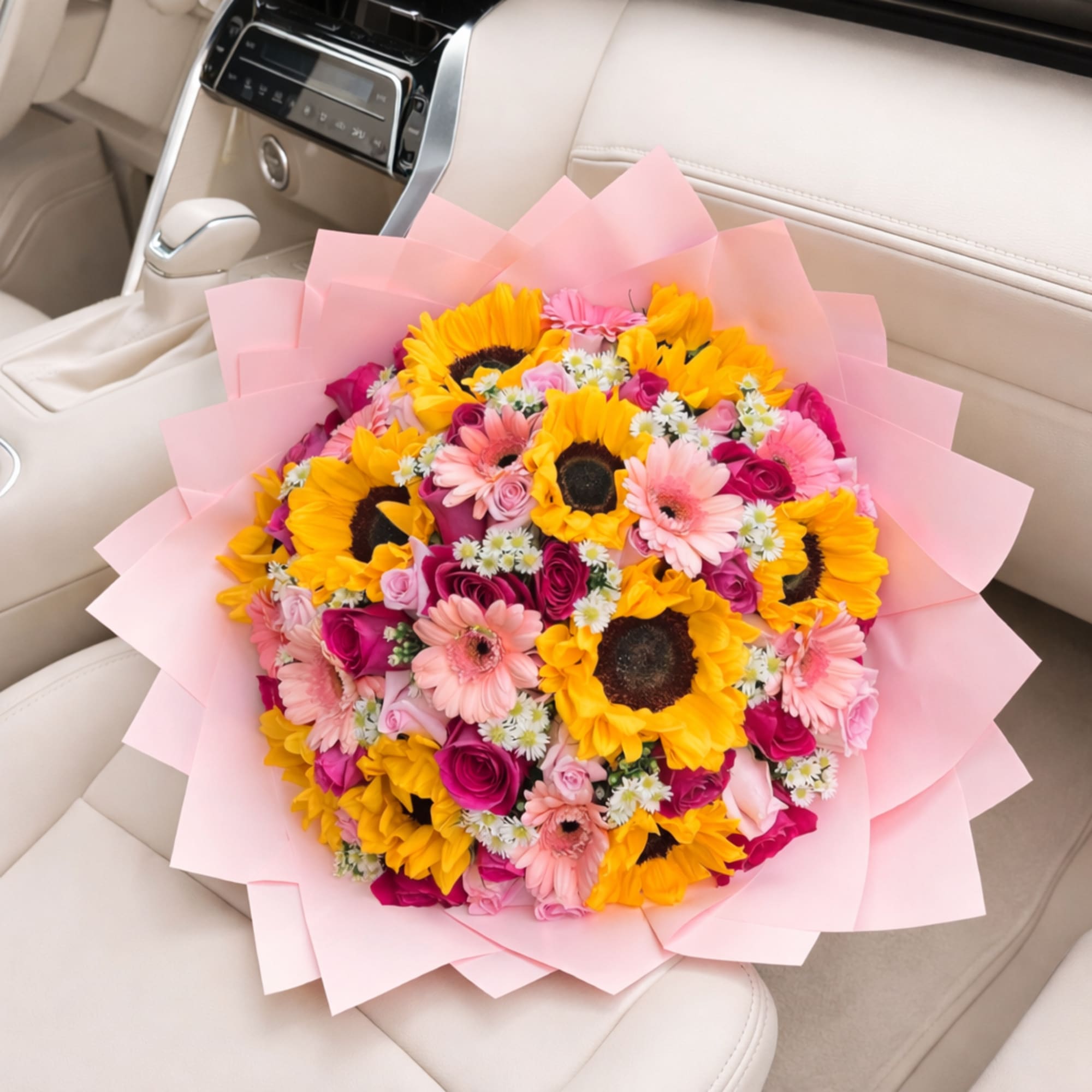 A vibrant bouquet that radiates warmth and joy. This arrangement combines radiant