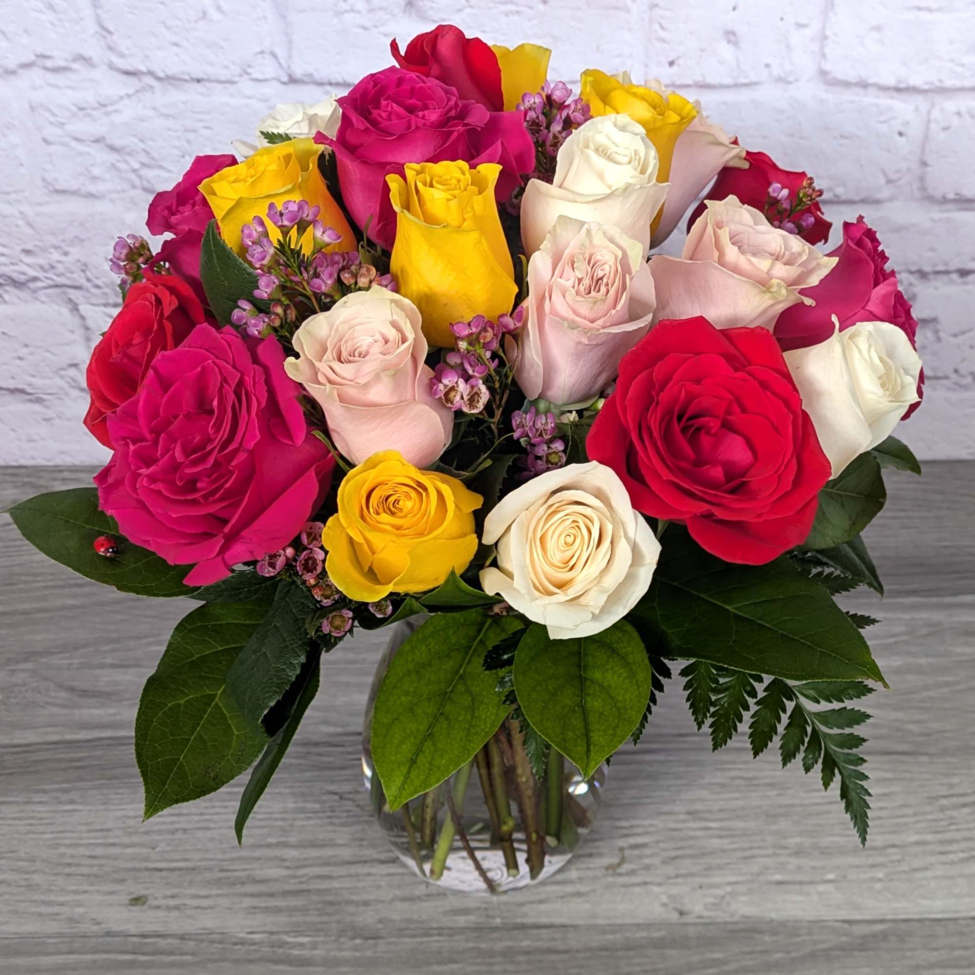 Twenty-four Medium Stemmed Roses is A Ladybug Floral exclusive bouquet. This bouquet