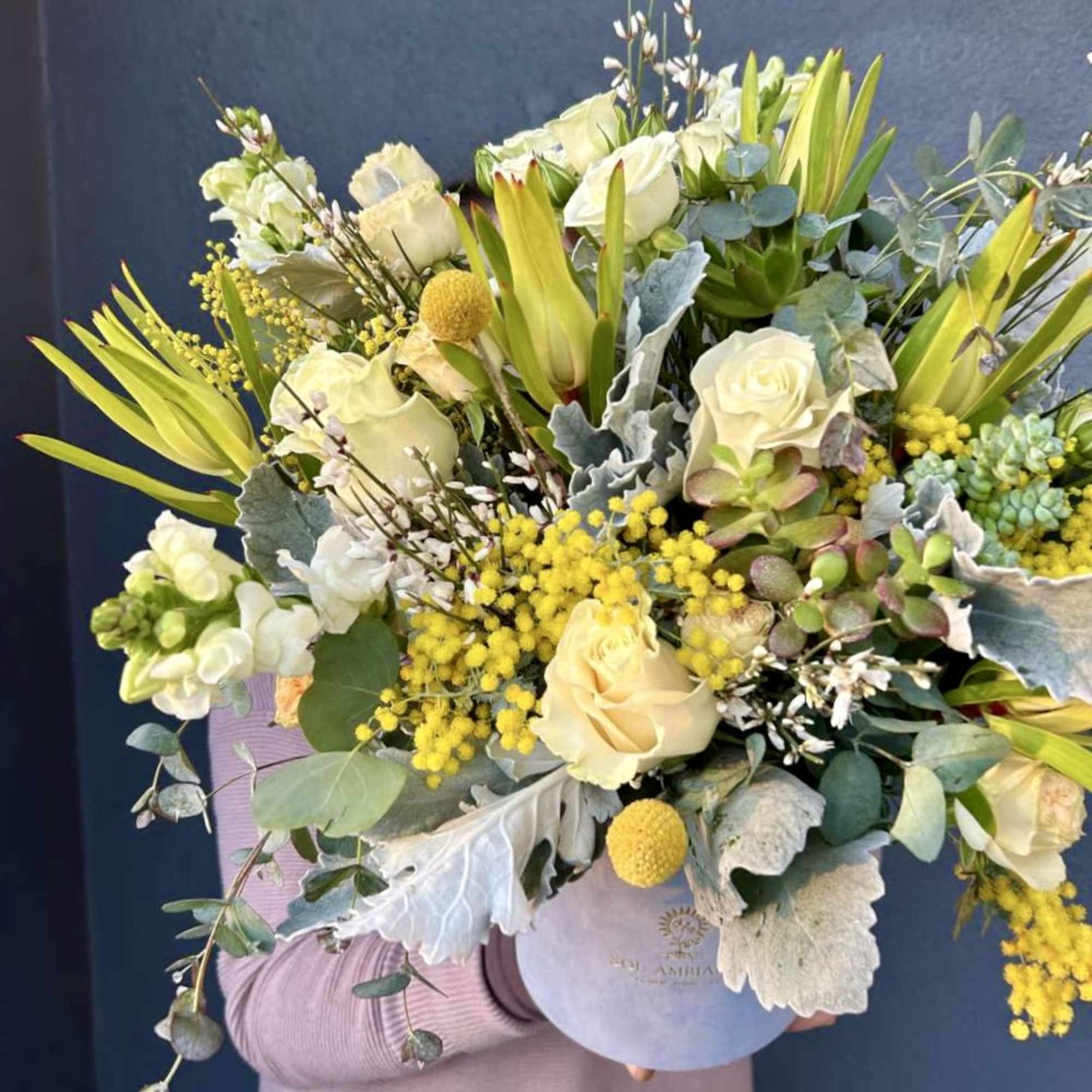 A beautiful velvet blue logo box full of gorgeous flowers. Large and