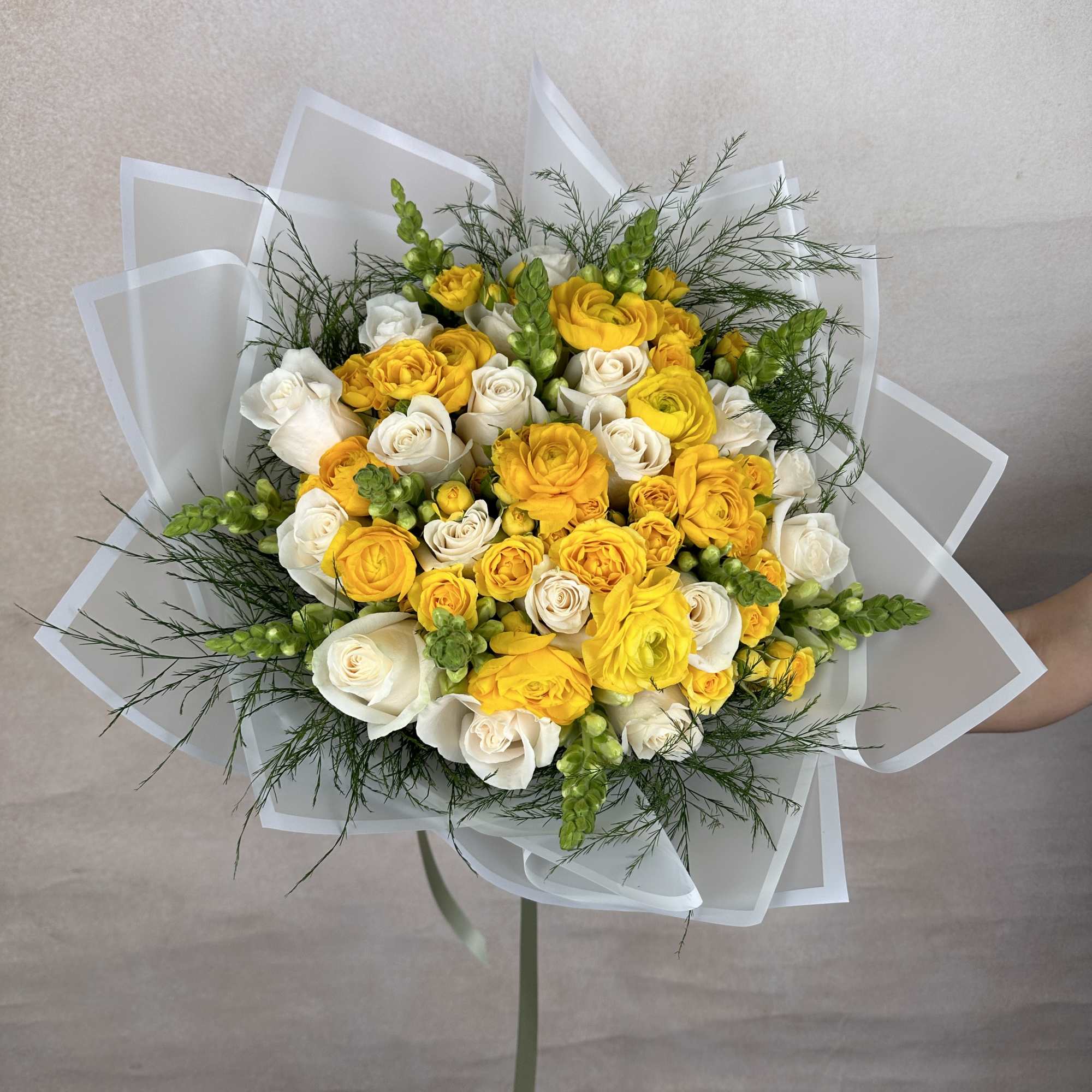 Yellow Delight is a vibrant and elegant bouquet featuring lush roses, striking
