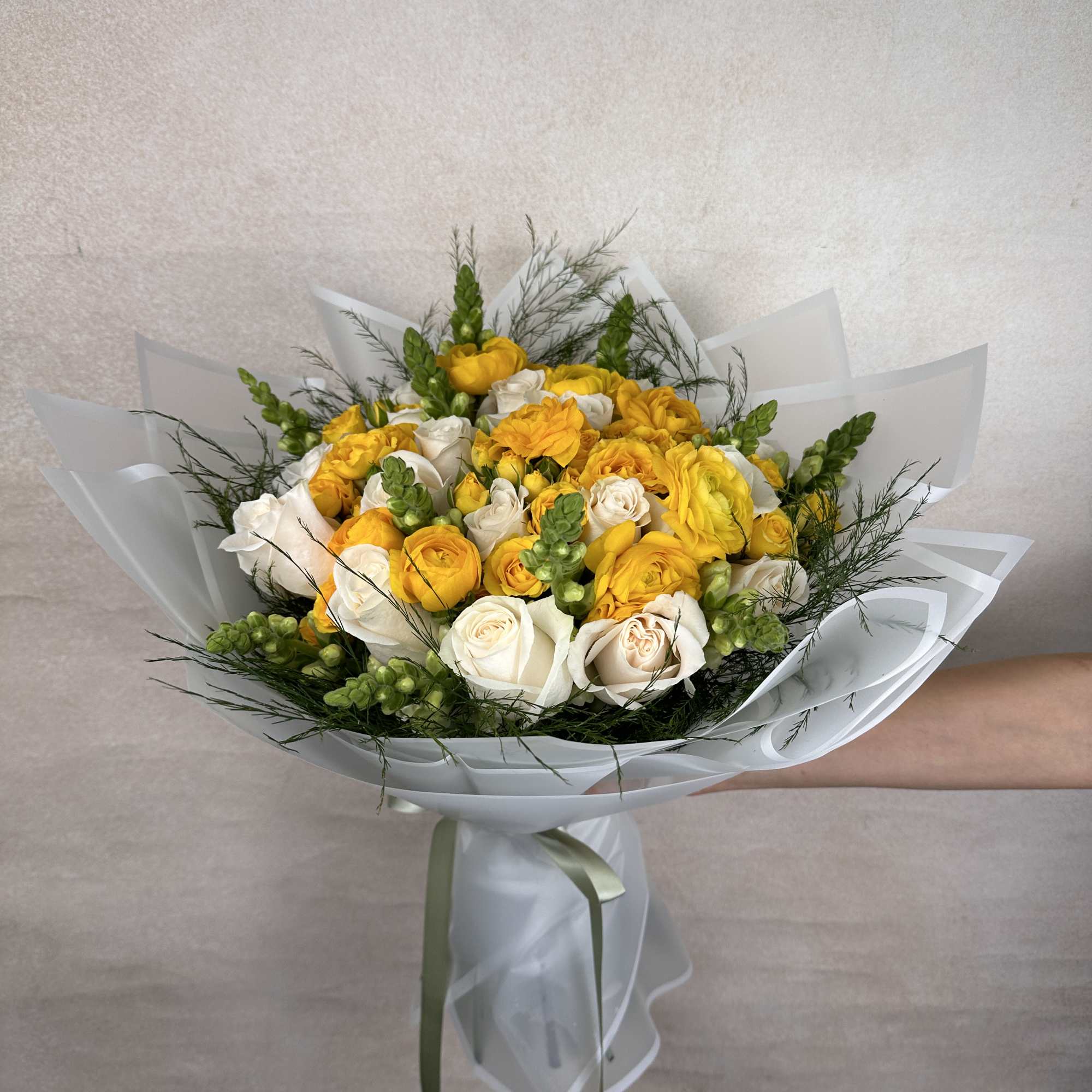 Yellow Delight is a vibrant and elegant bouquet featuring lush roses, striking