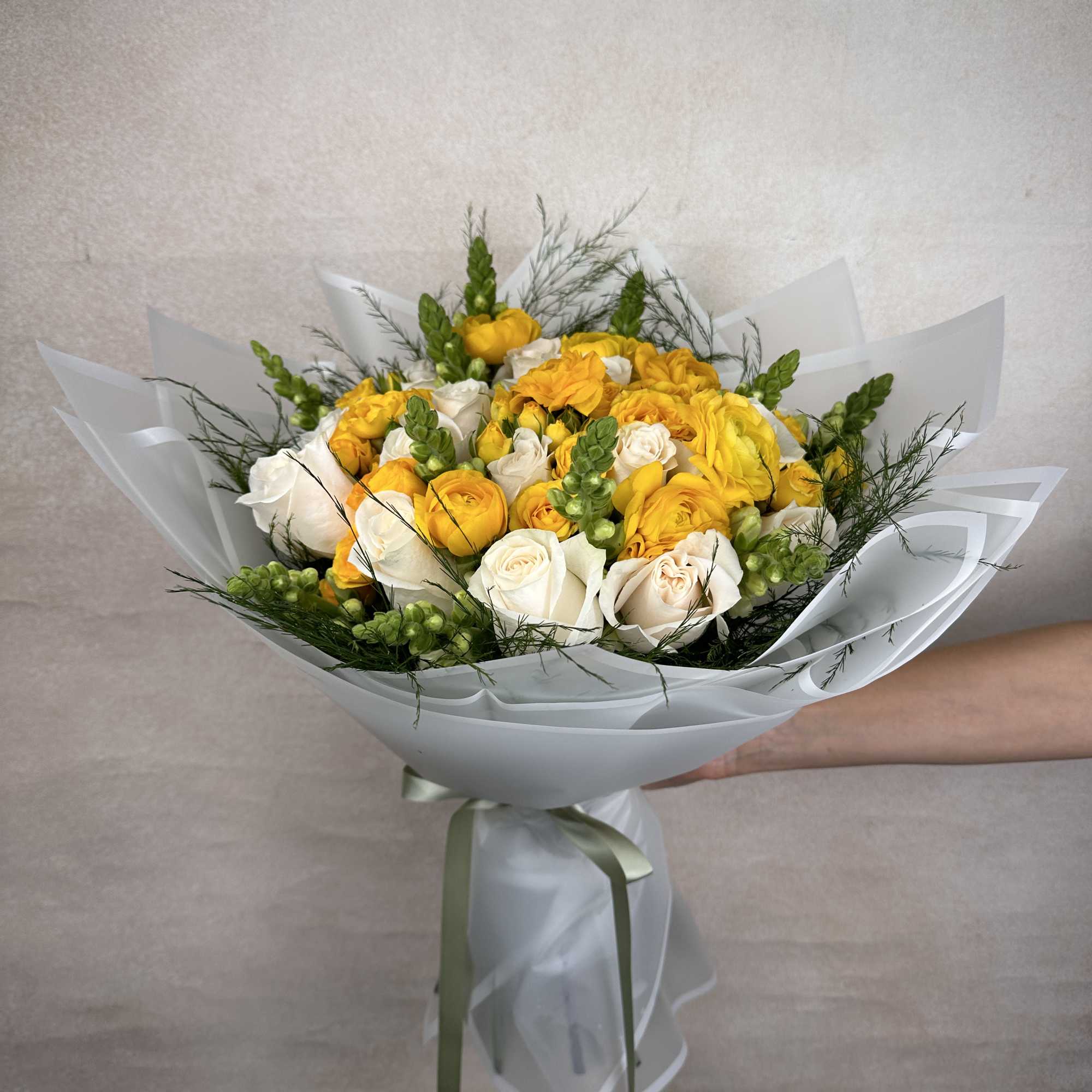 Yellow Delight is a vibrant and elegant bouquet featuring lush roses, striking