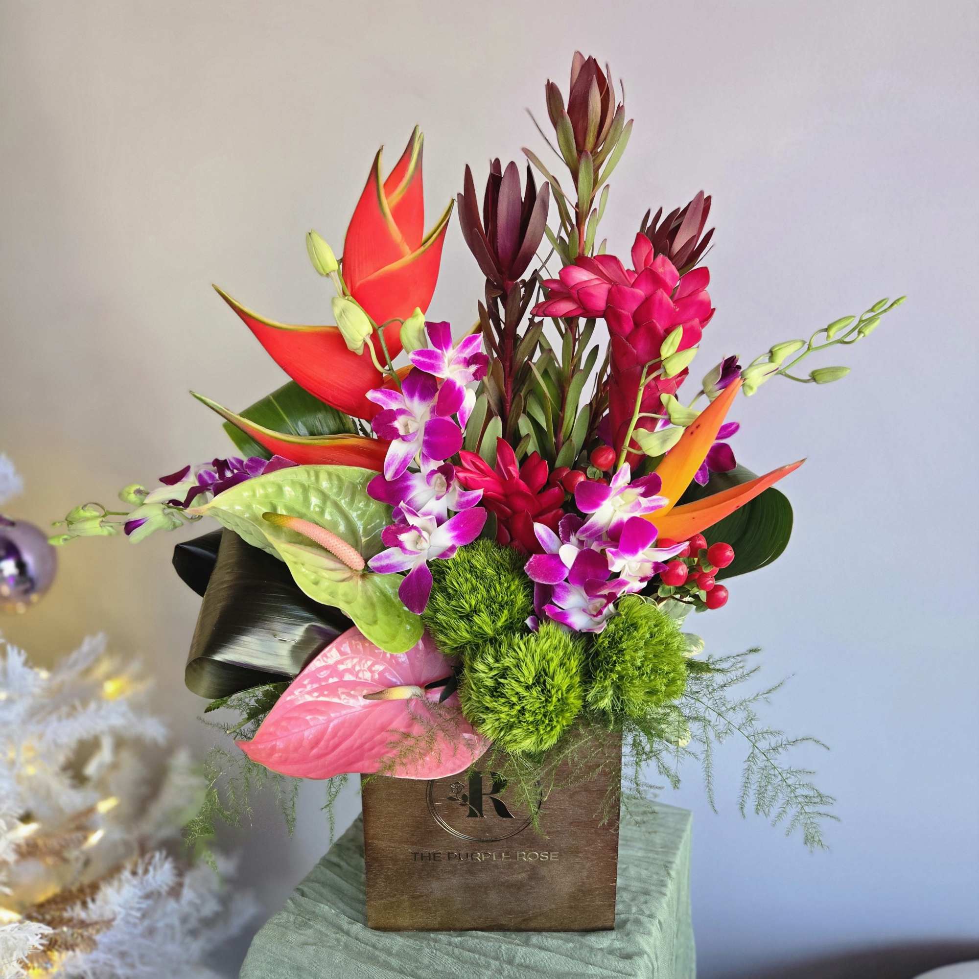 This tropical arrangement is perfect for your traveling friend, business partner, or