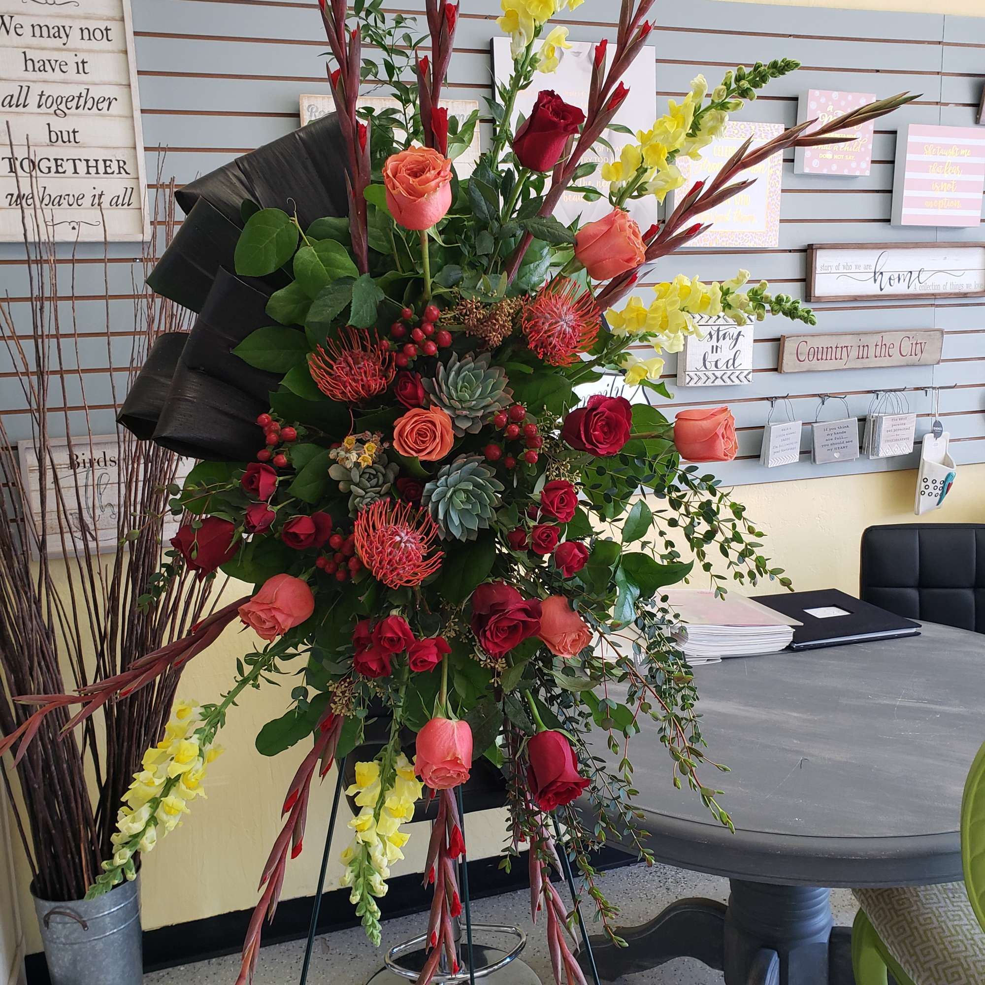 This tastefully done funeral spray is full of vibrant desert colors, 