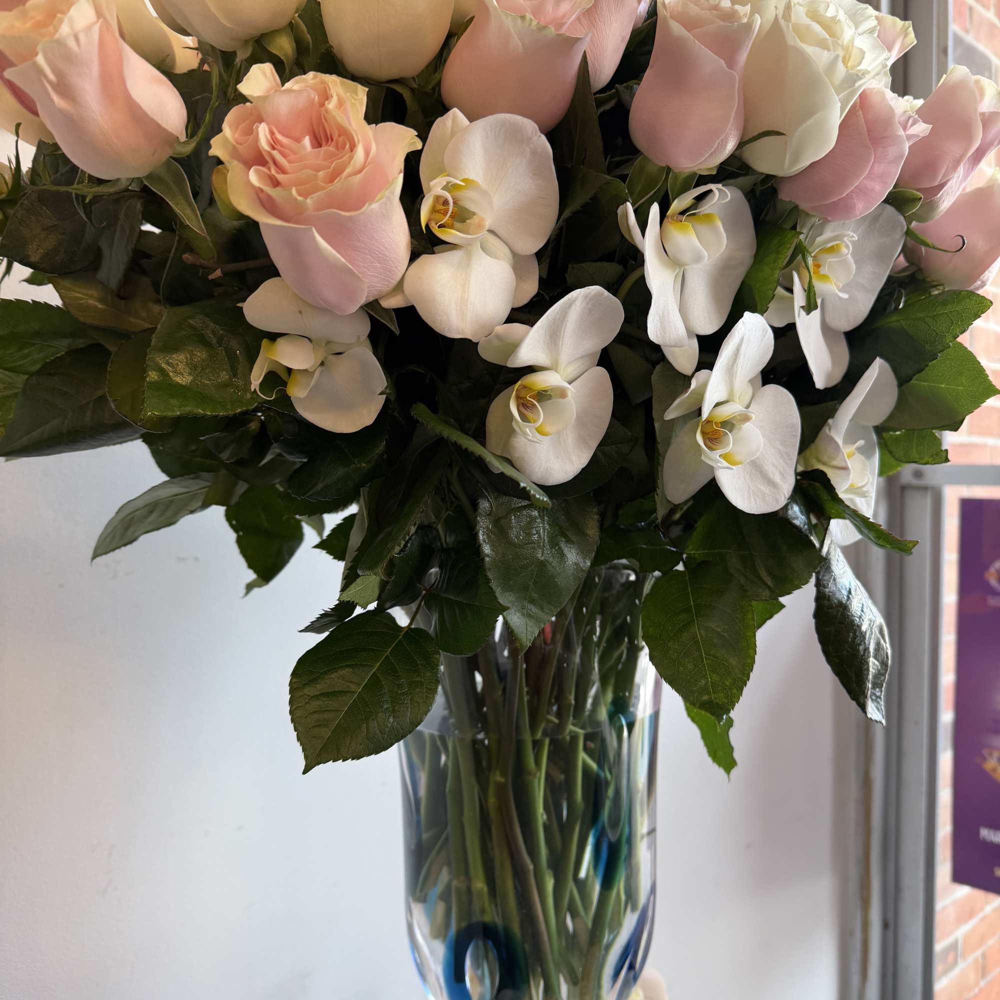 Luxury vase with a favorite touch of pink and white roses, perfectly