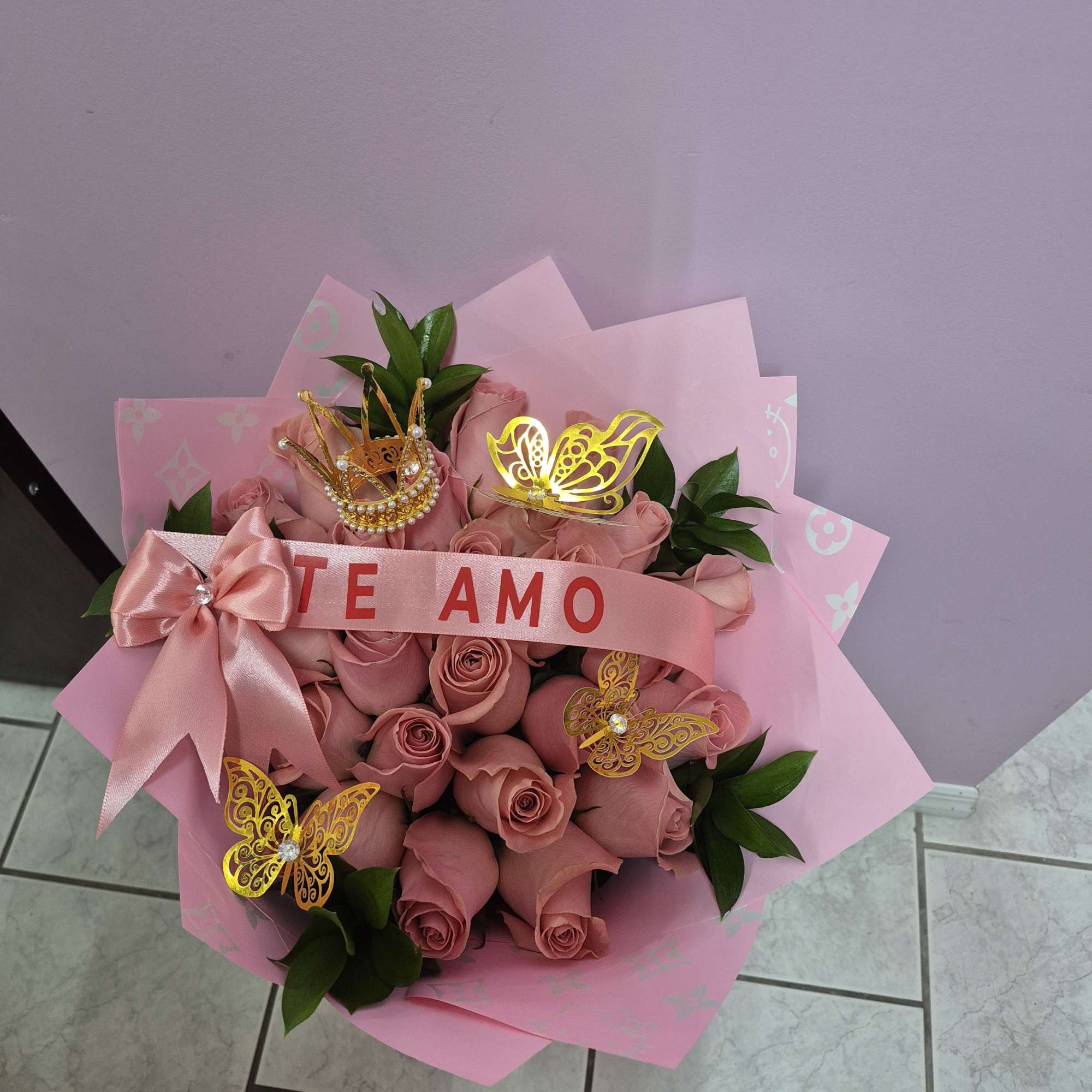 two dozen pink roses with decoration